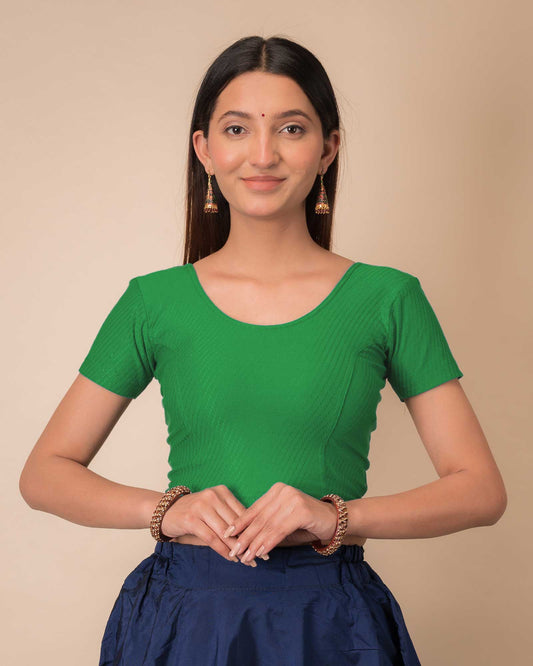 Model wearing a  stretchable dobby cotton blouse with half sleeves and round neckline