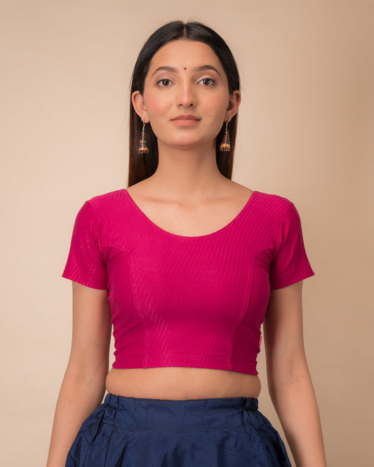 Model wearing a  stretchable dobby cotton blouse with half sleeves and round neckline