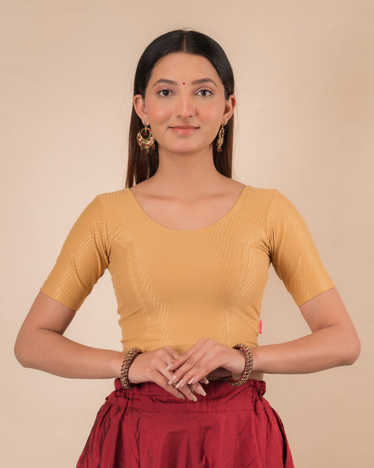 Model wearing a dobby cotton stretchable blouse with elbow sleeves and round neckline