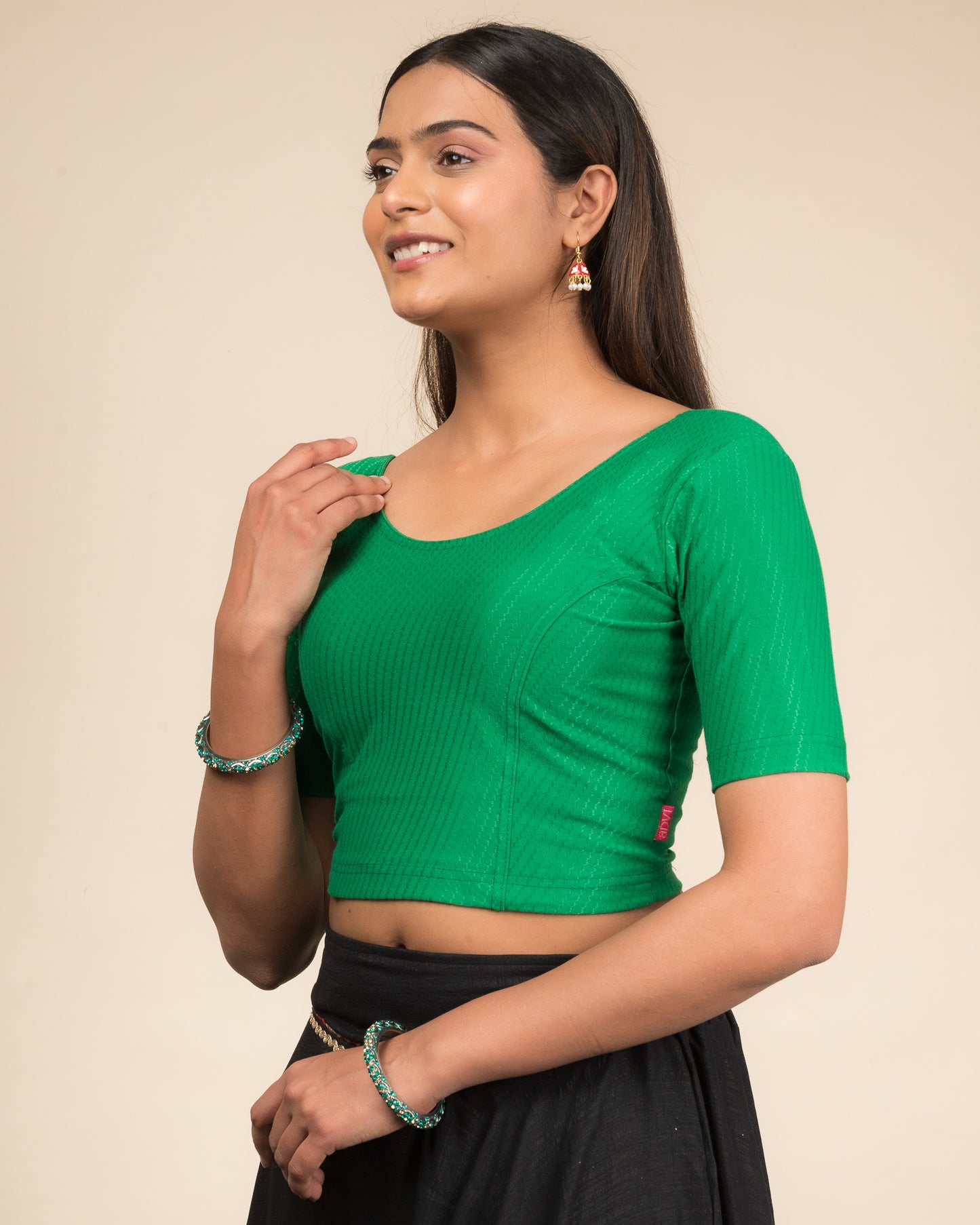 Side profile highlighting sleeve length and silhouette