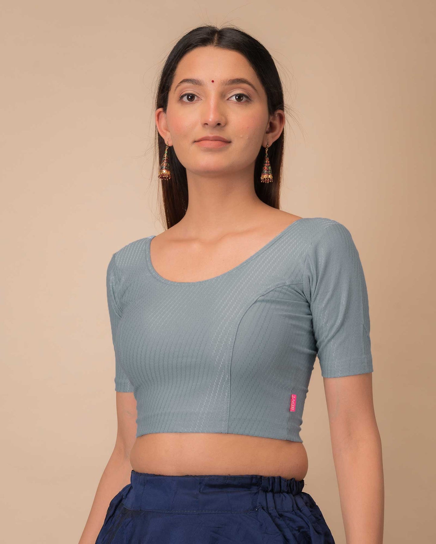Side profile highlighting sleeve length and silhouette