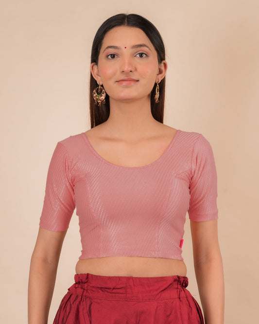 Model wearing a dobby cotton stretchable blouse with elbow sleeves and round neckline