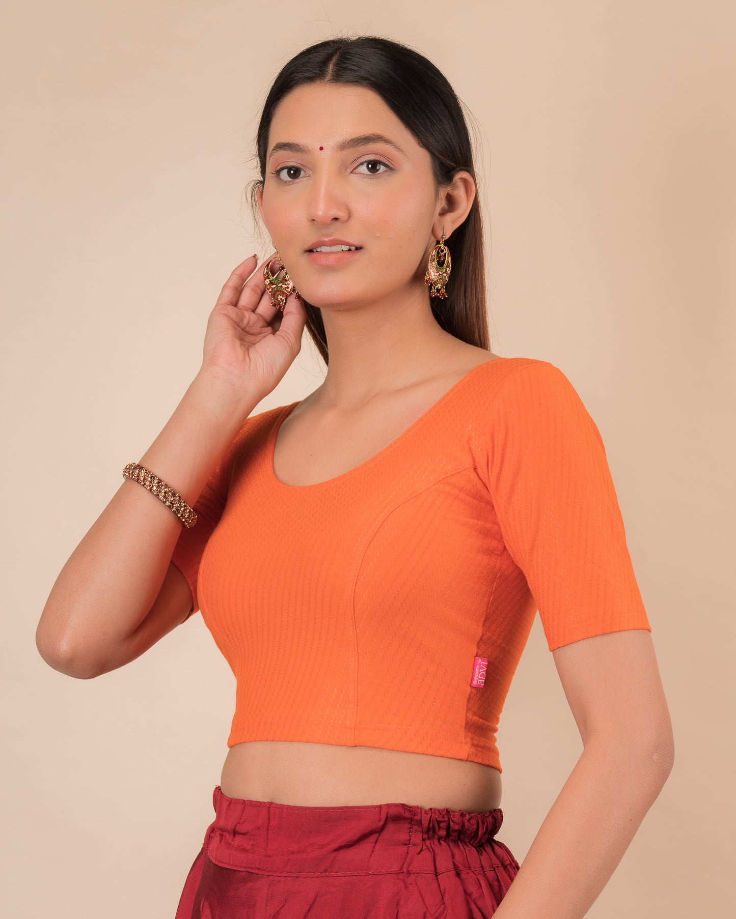 Side profile highlighting sleeve length and silhouette