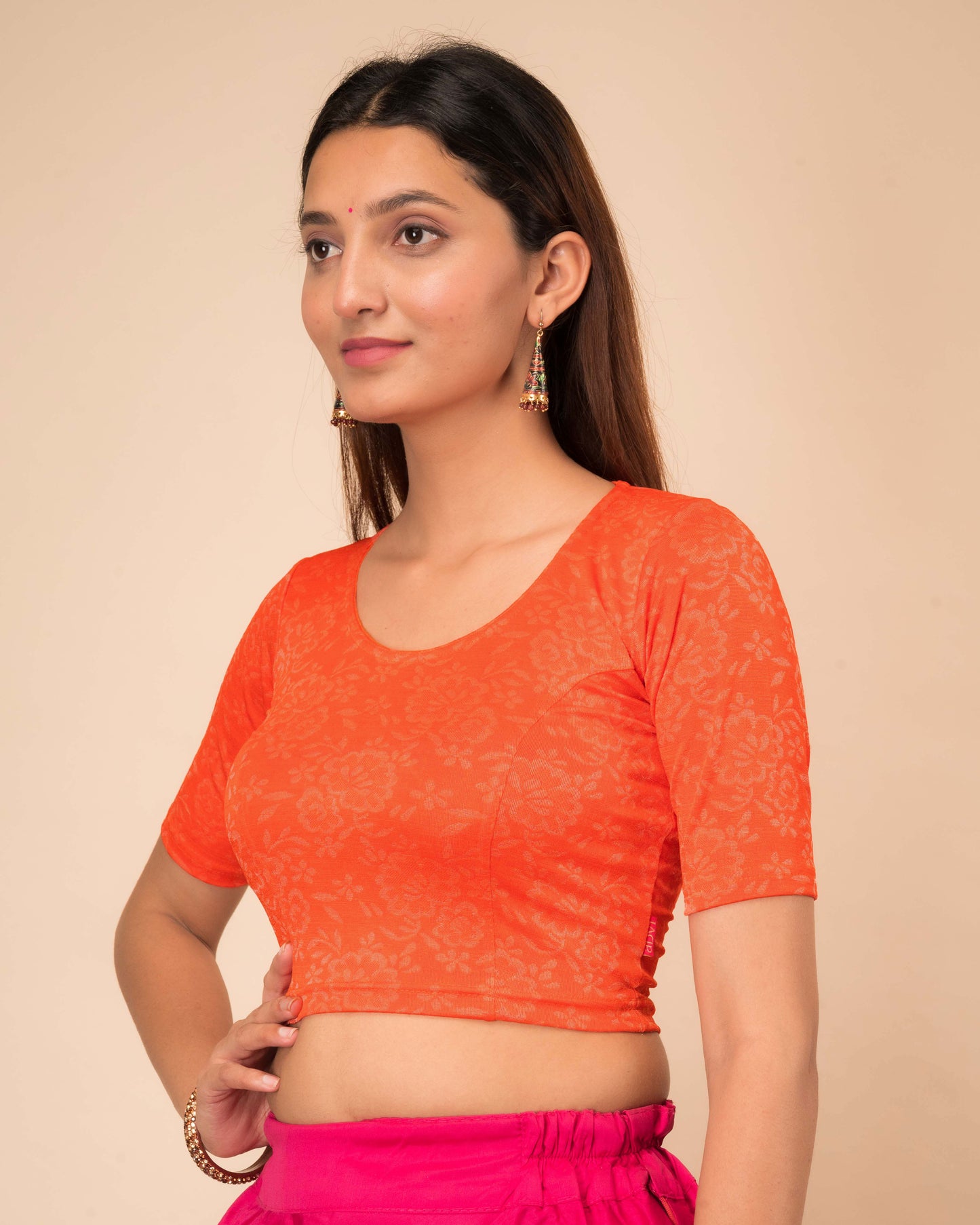 Ambreen Orange Frill Jacquard Blouse with Fancy Back Cut by Advi