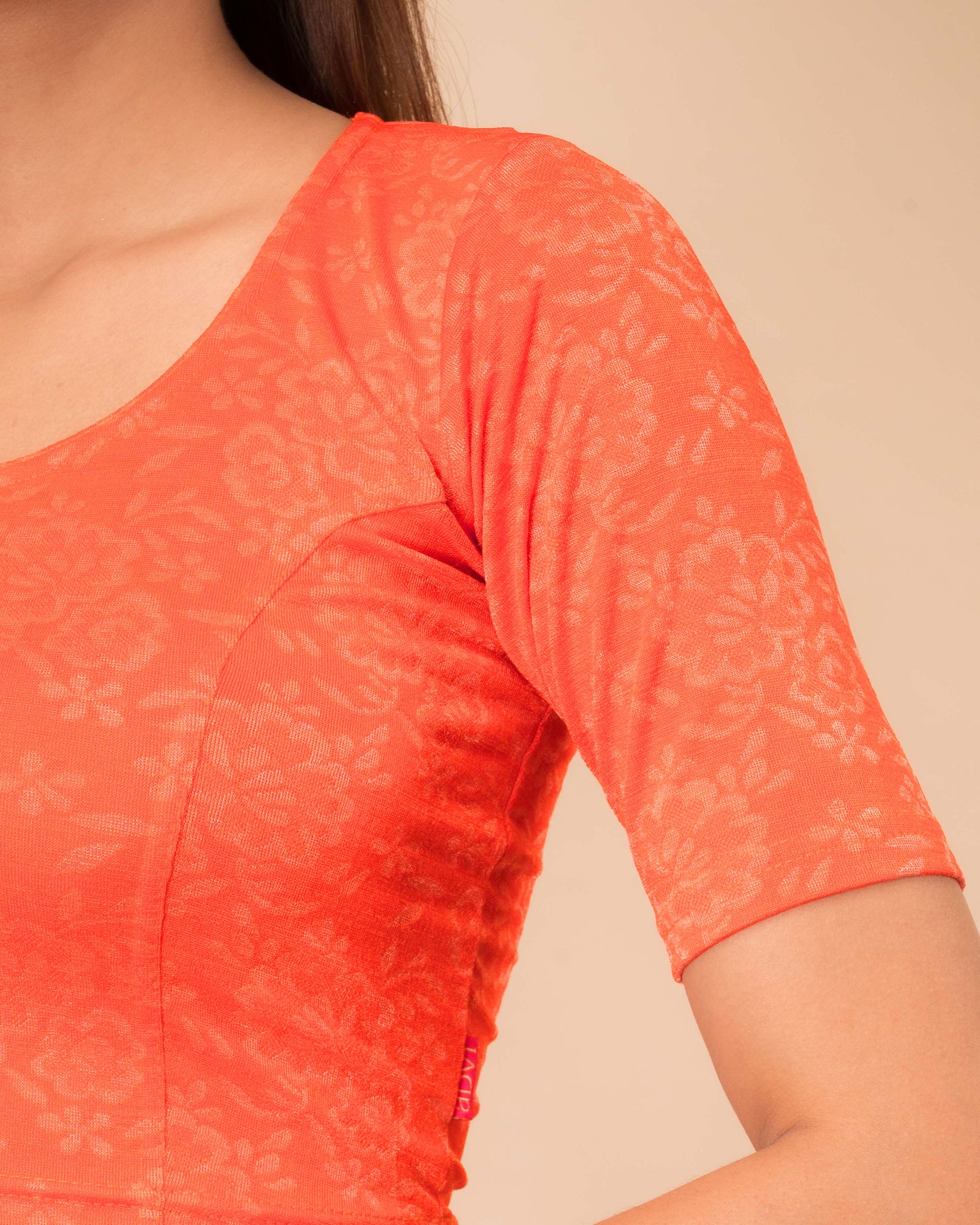 Ambreen Orange Frill Jacquard Blouse with Fancy Back Cut by Advi