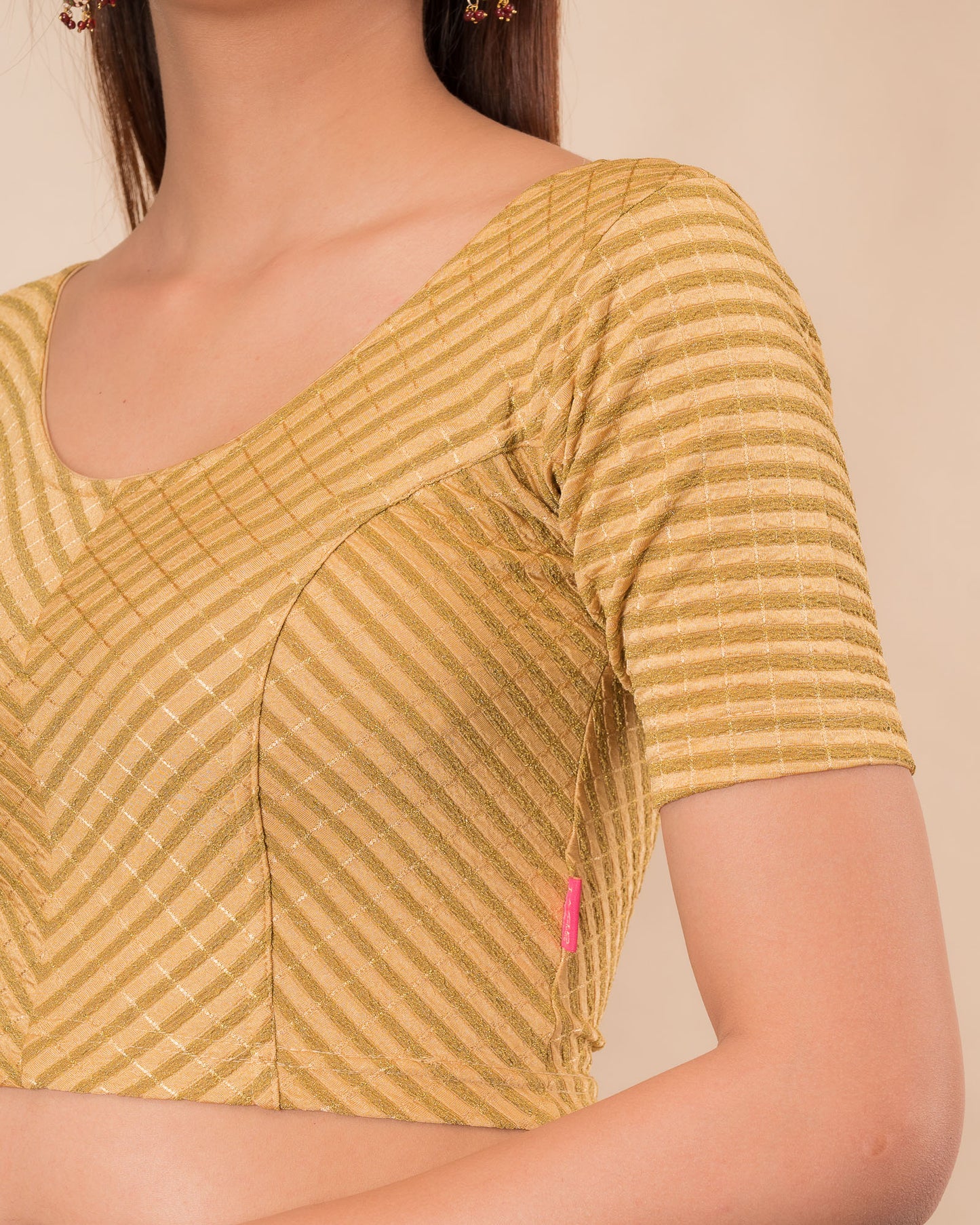 Close‑up showing the texture and metallic zari striping