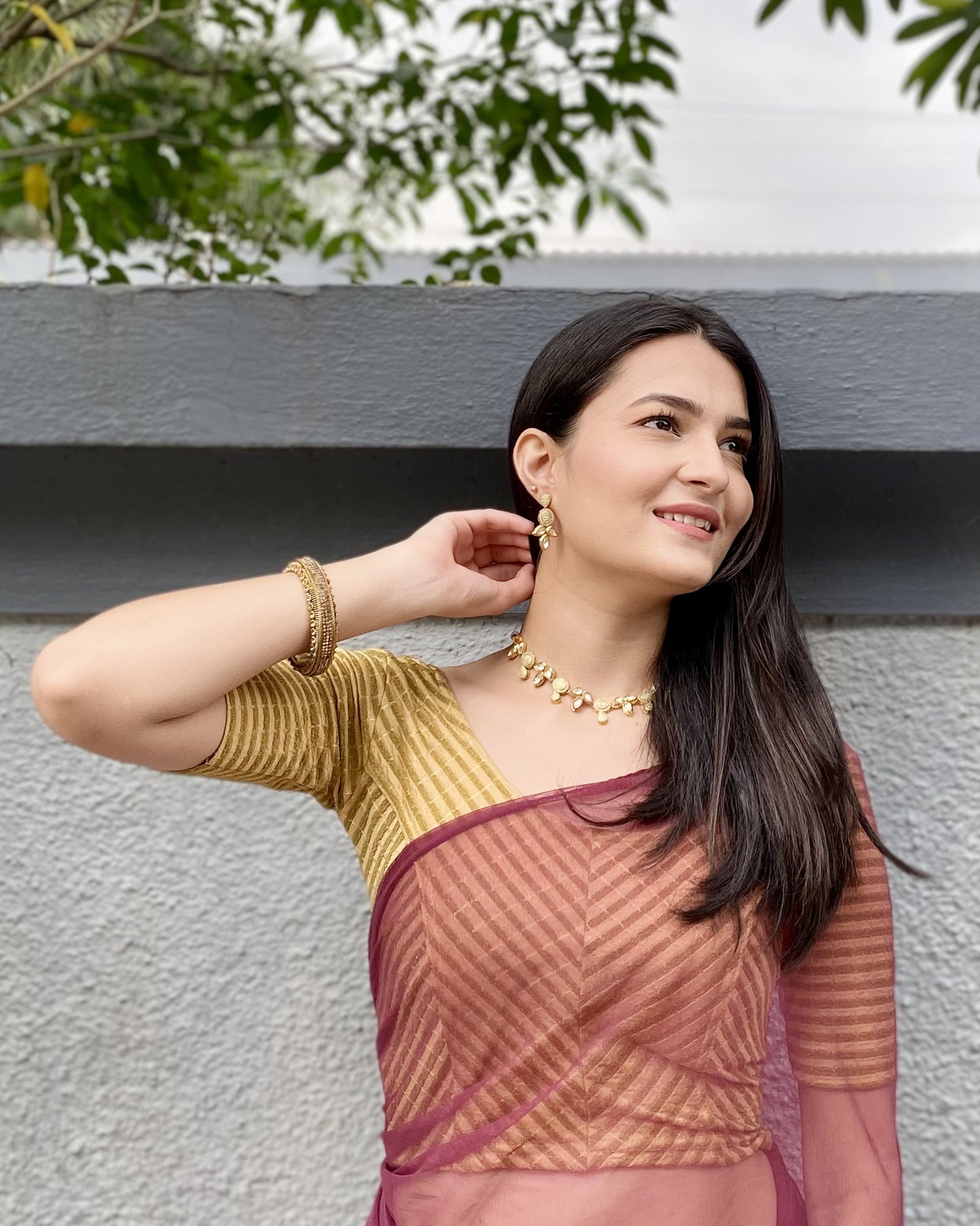Model pairing the blouse with a saree for a bold, festive look