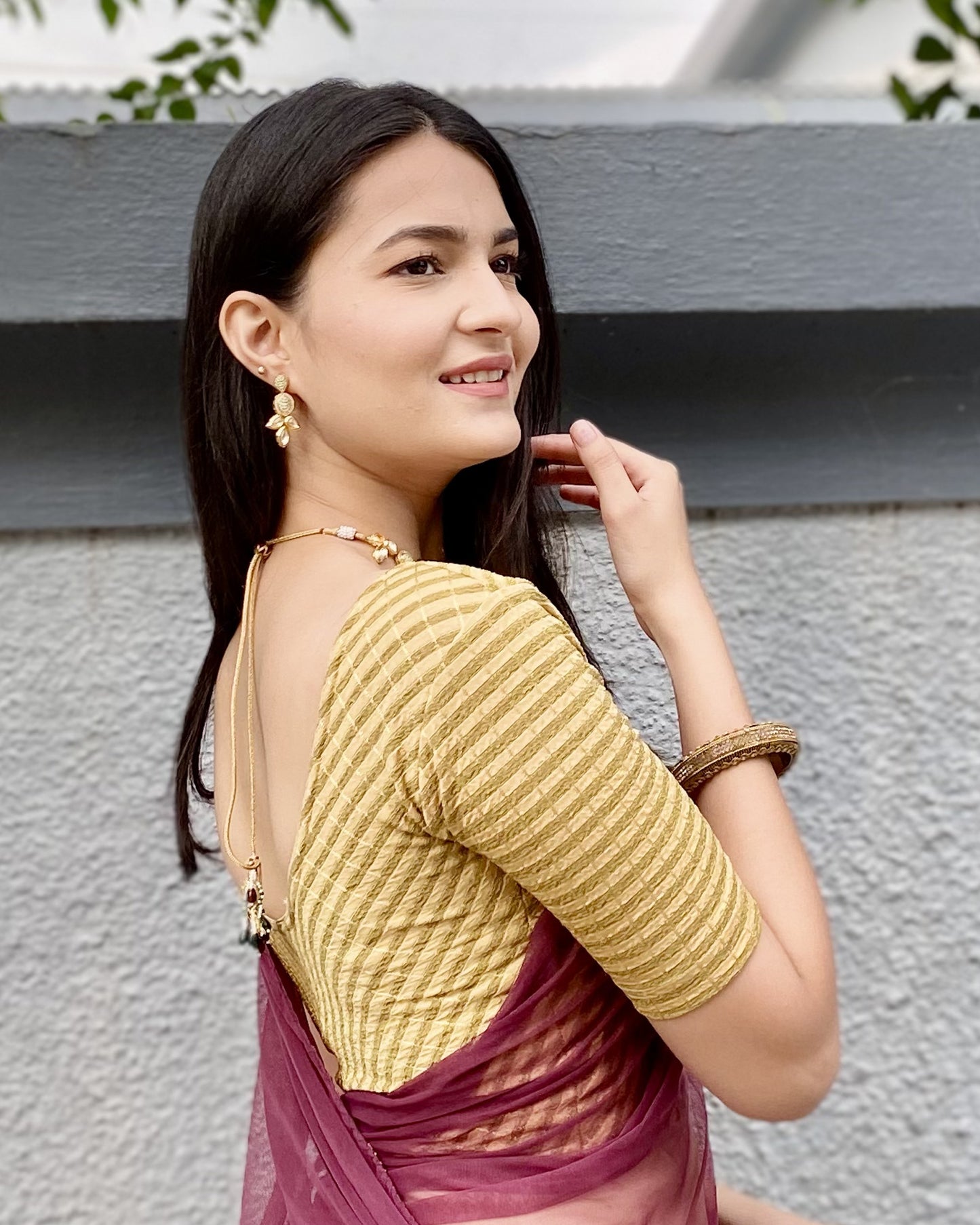 Model pairing the blouse with a saree for a bold, festive look