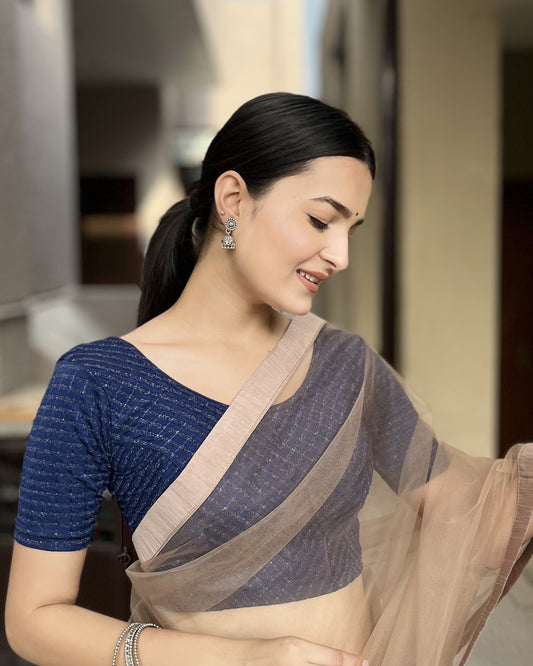 Model pairing the blouse with a saree for a bold, festive look.