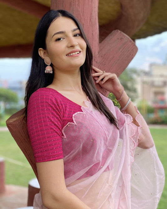 Model pairing the blouse with a saree for a bold, festive look