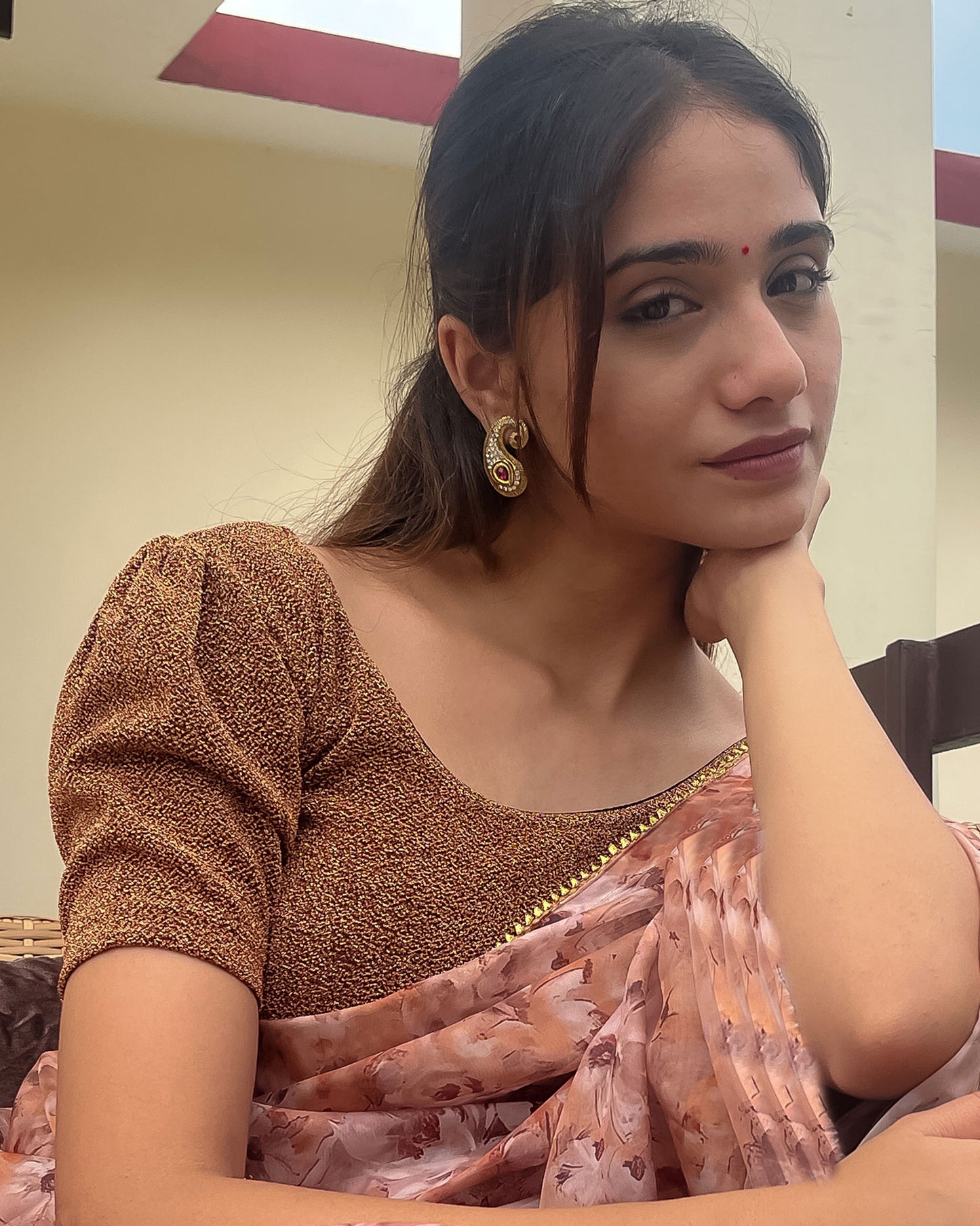 Model pairing the blouse with a saree for a polished festive ensemble