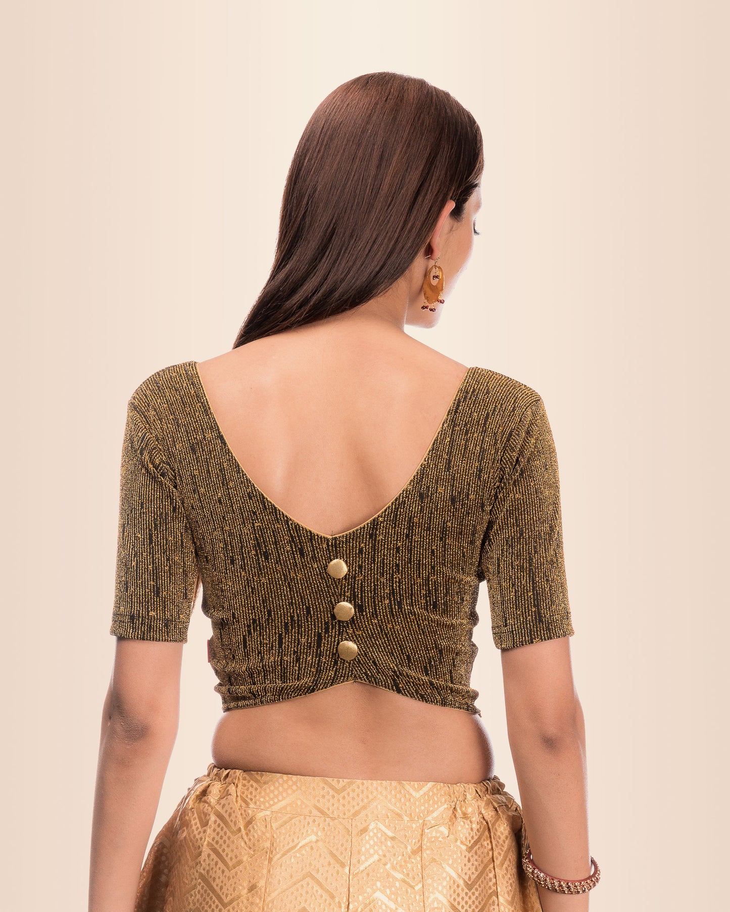 Rear view showing the button-placket back design.