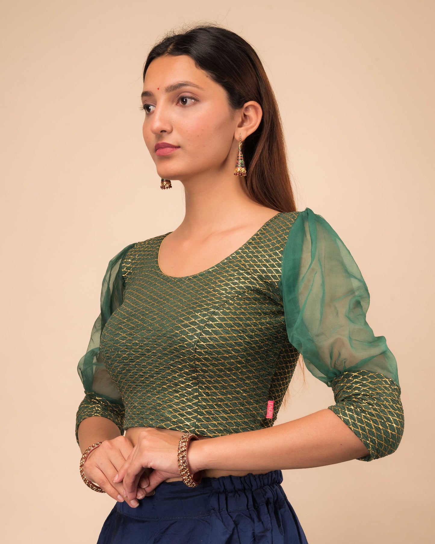Side profile highlighting the puffed sleeves with cuffs
