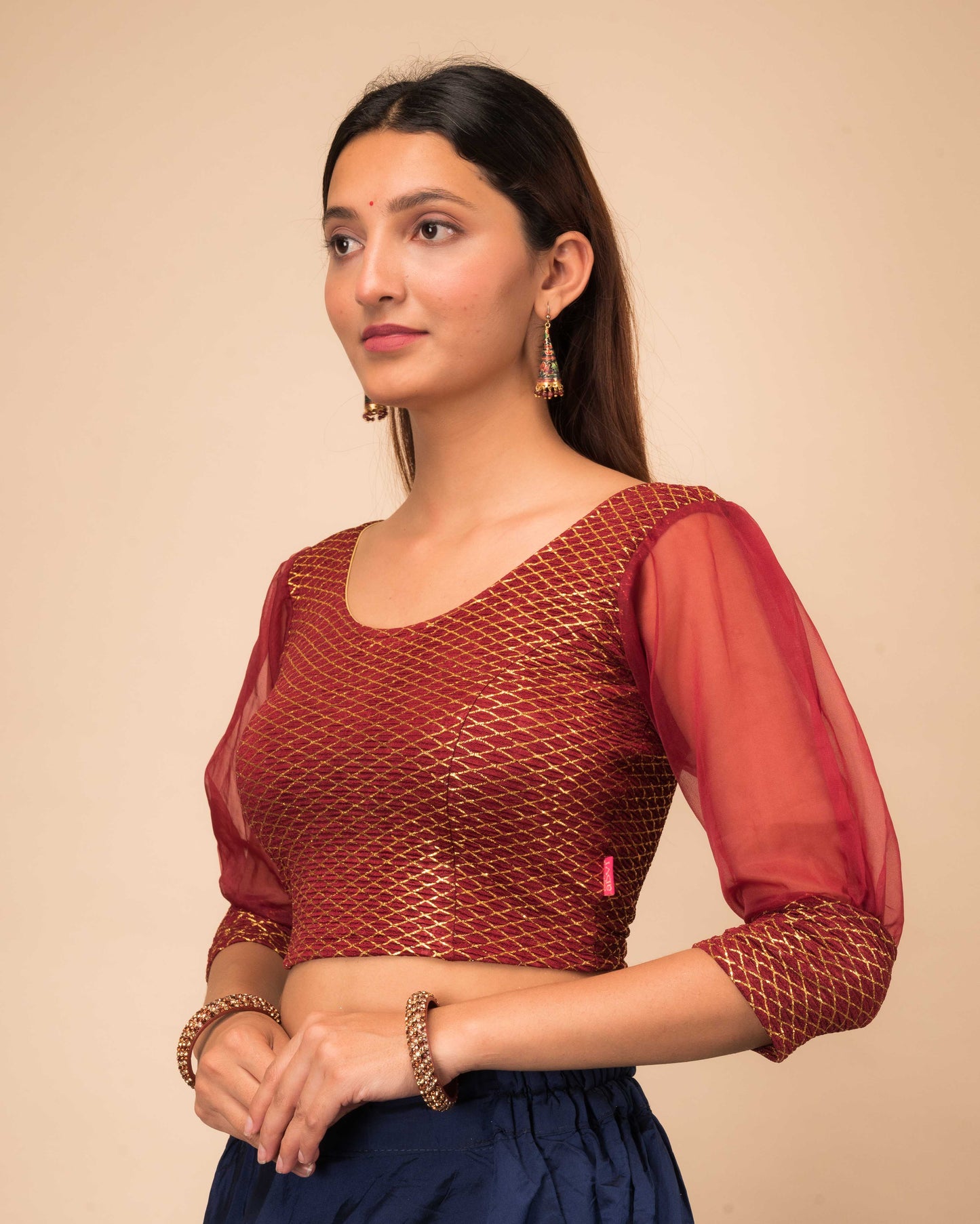 Side profile highlighting the puffed sleeves with cuffs