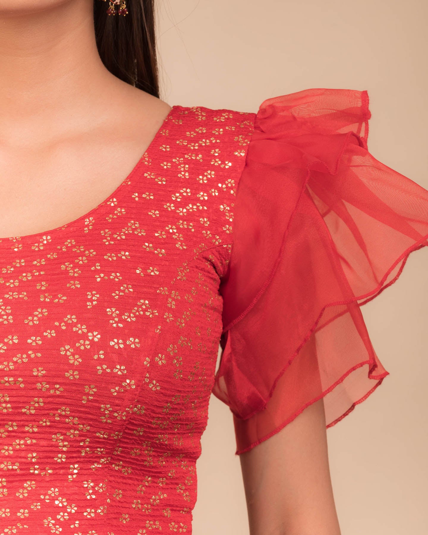 Close-up of the foil floral print on organza in lightweight stretch texture