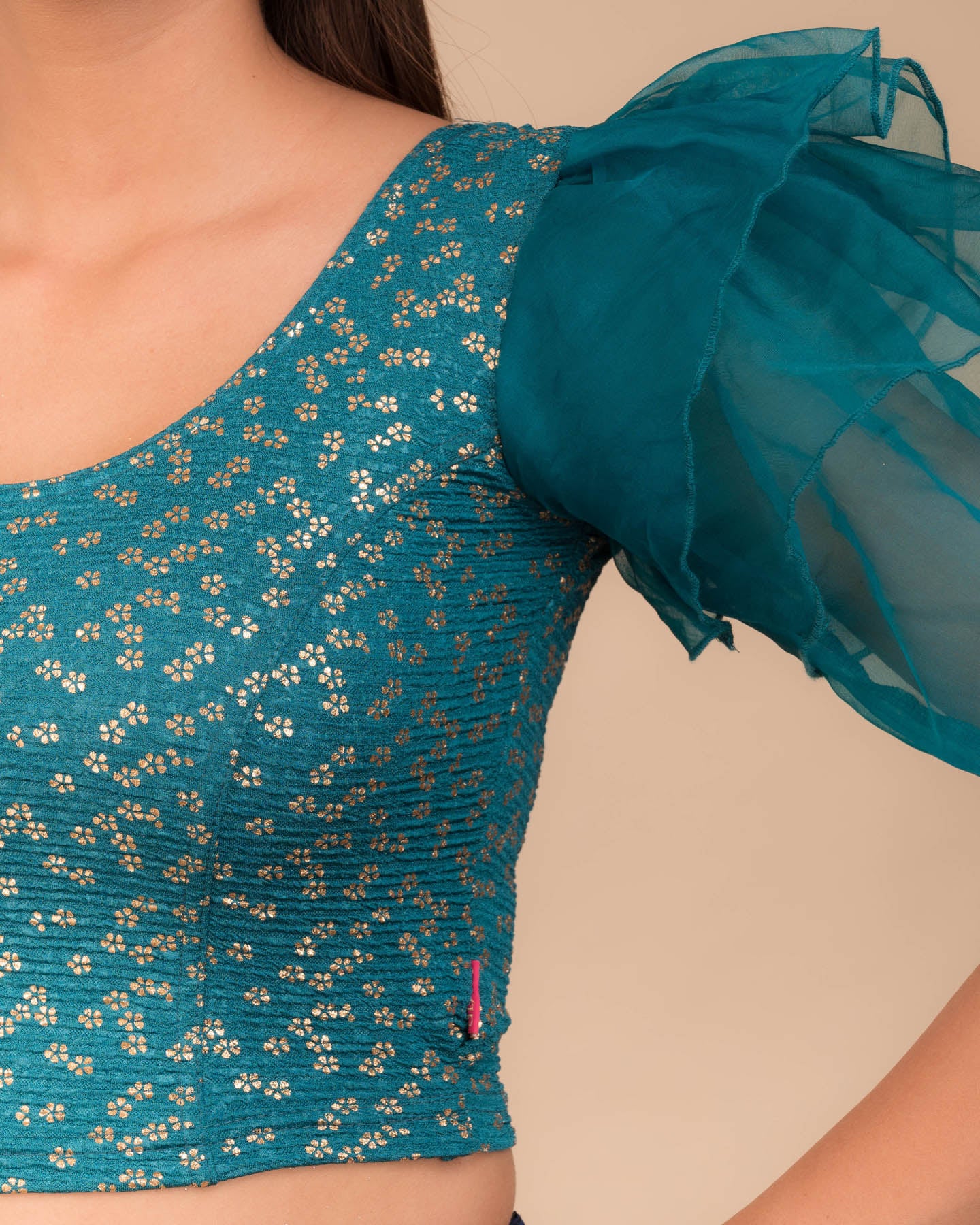Close-up of the foil floral print on organza in lightweight stretch texture
