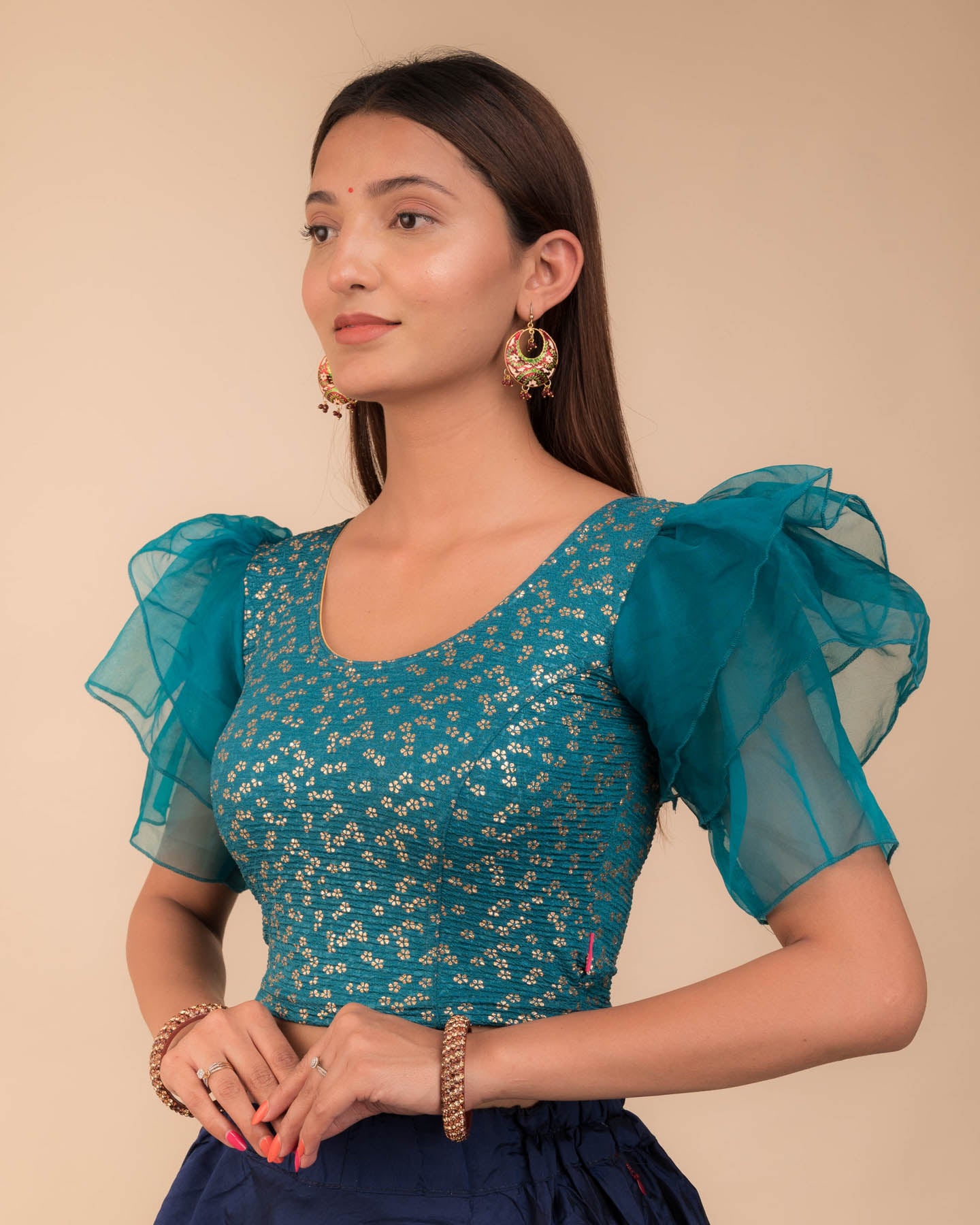 Side angle highlighting the sleeve depth and fit silhouette
