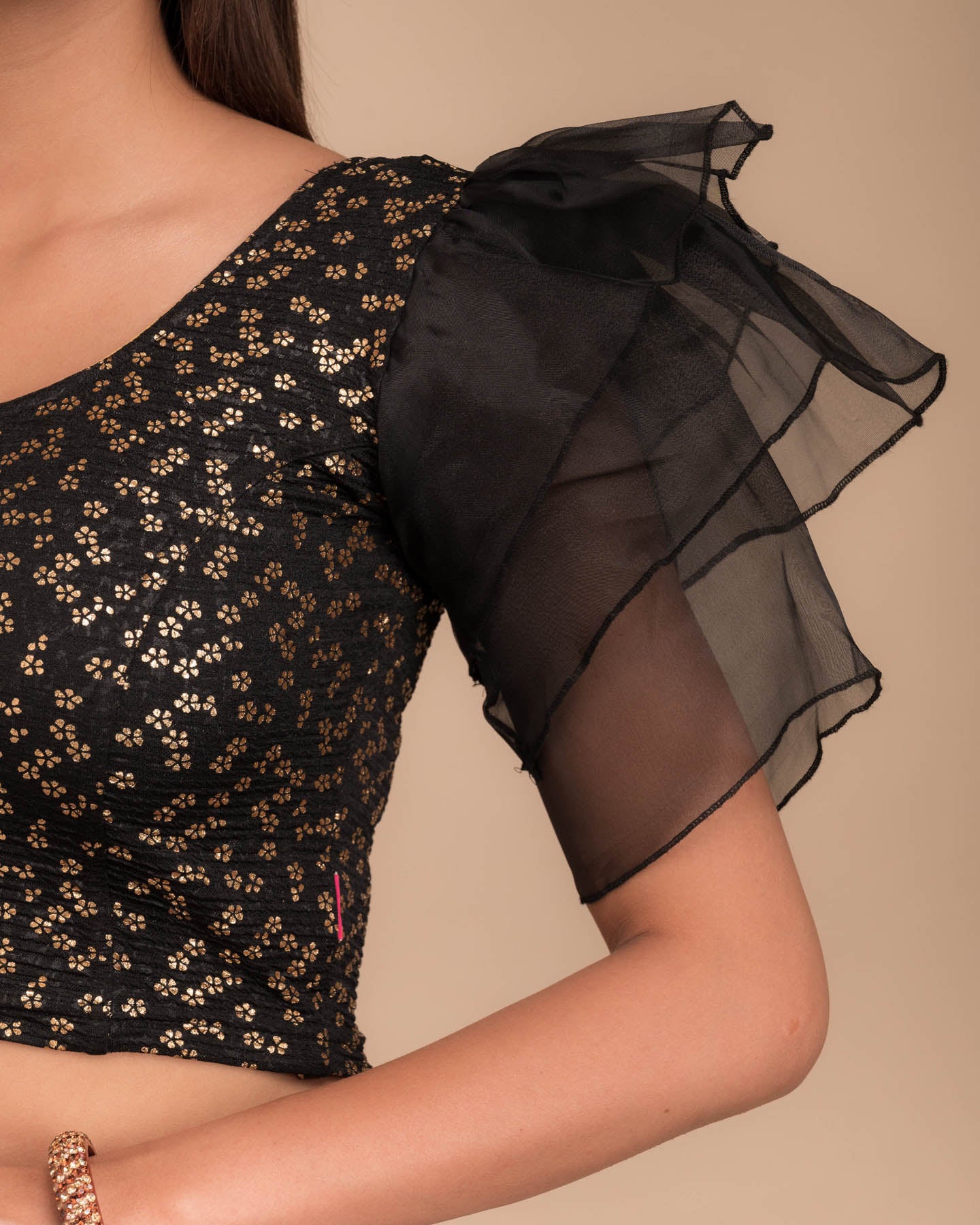 Close-up of the foil floral print on organza in lightweight stretch texture