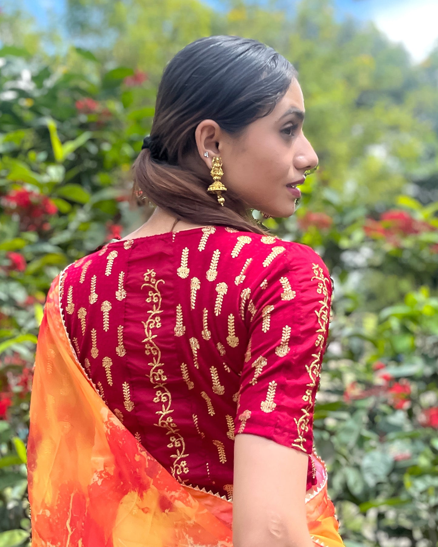 Model pairing the blouse with a saree for a festive look