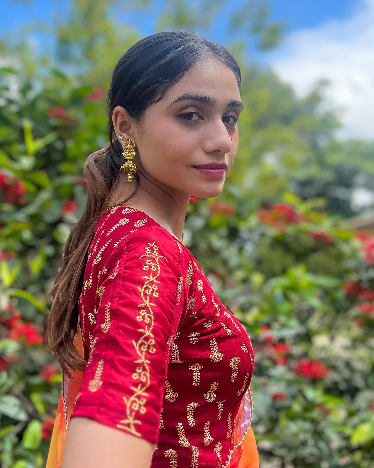 Model pairing the blouse with a saree for a festive look