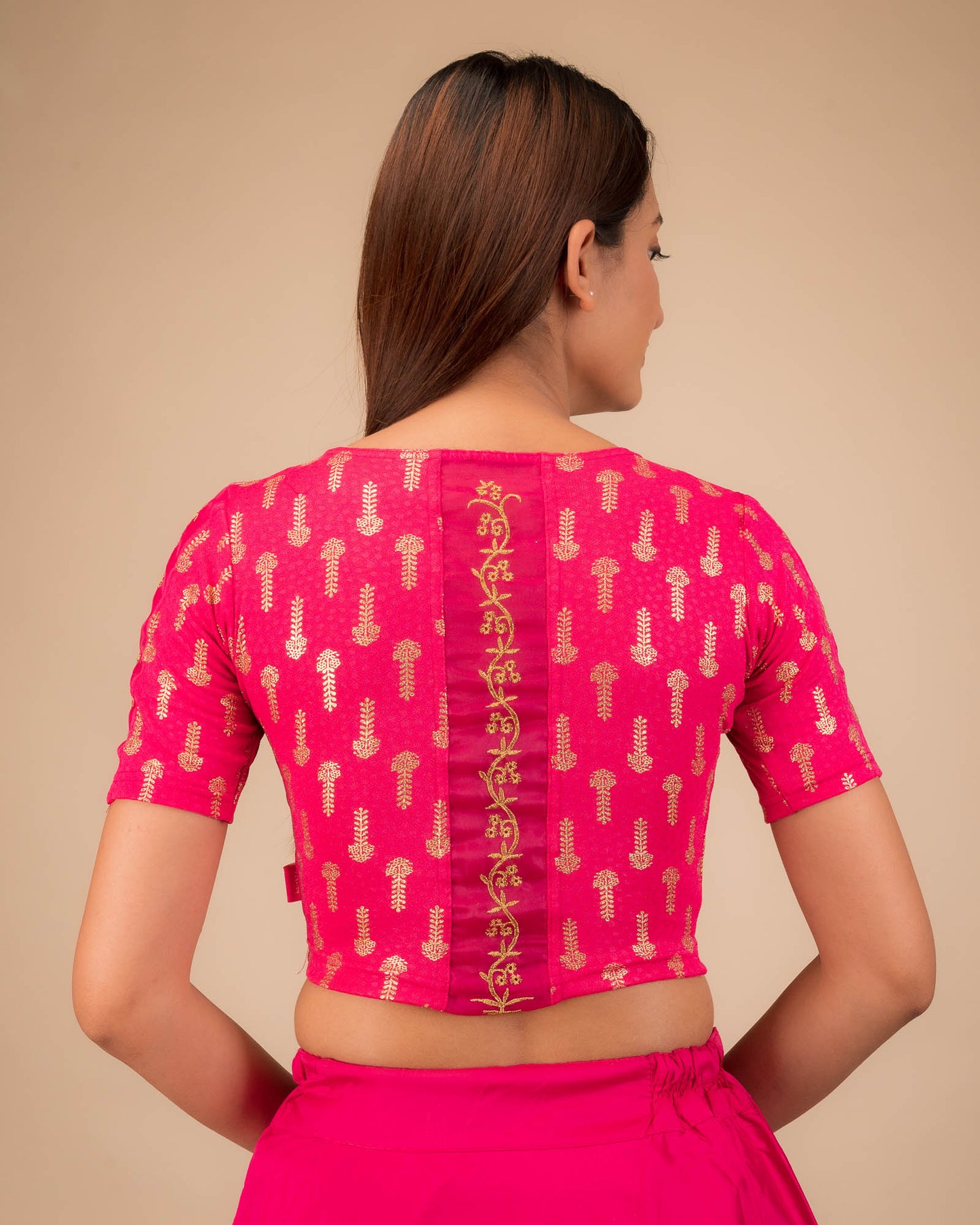 Rear view showcasing the embroidered zig-zag pattern across the back.