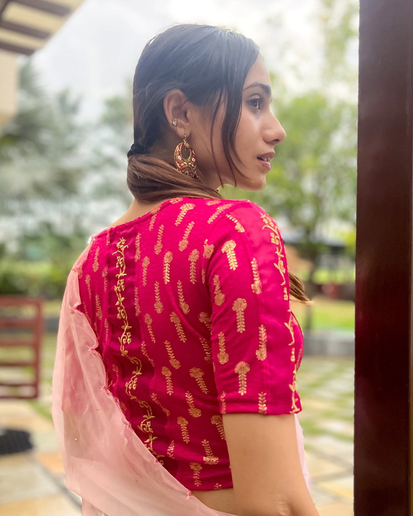 Model pairing the blouse with a saree for a festive look