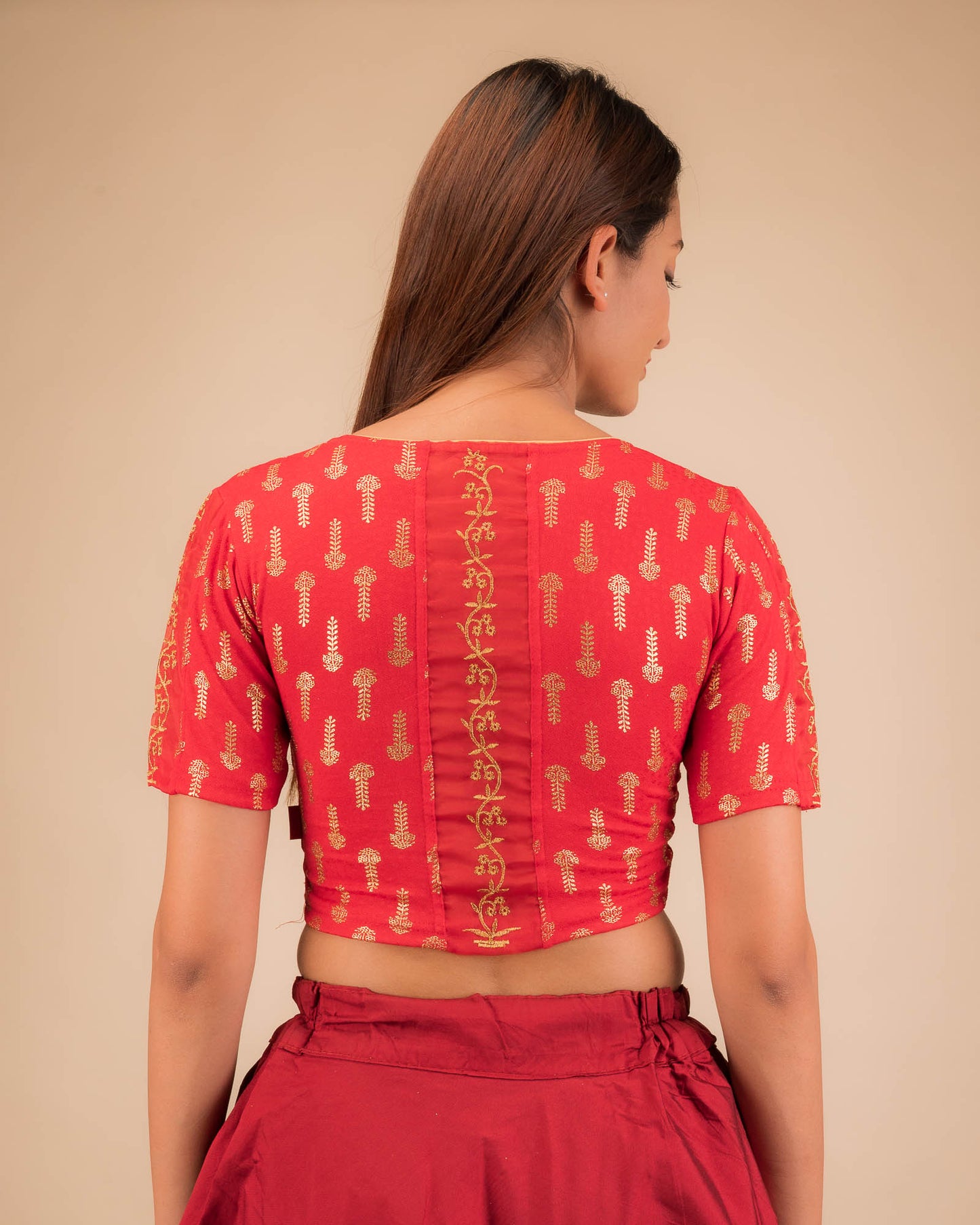 Rear view showcasing the embroidered zig-zag pattern across the back.