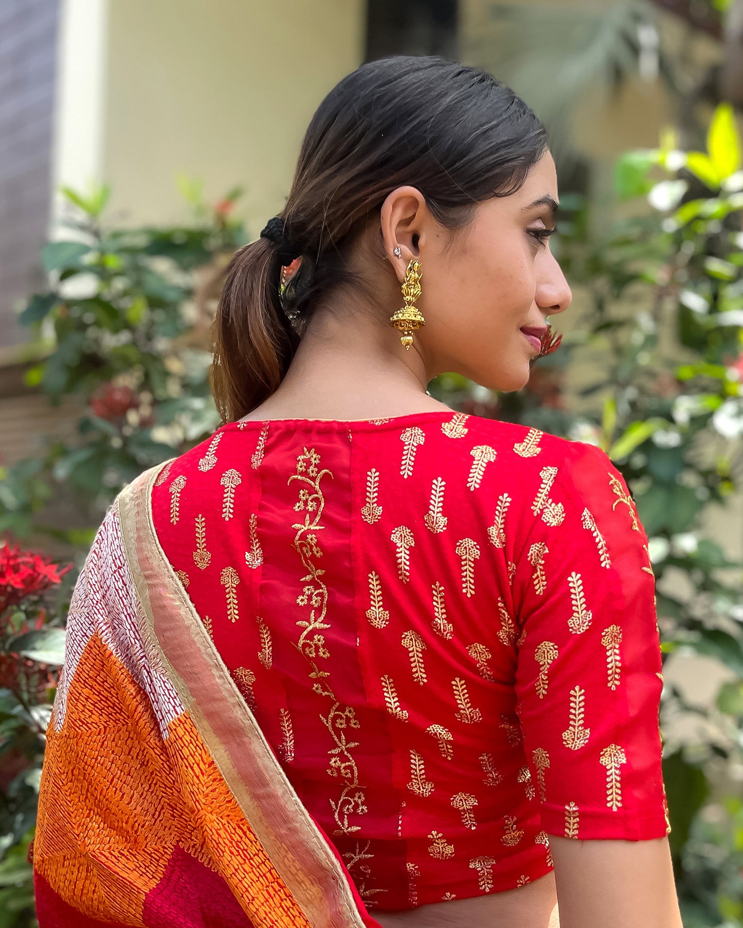 Model pairing the blouse with a saree for a festive look