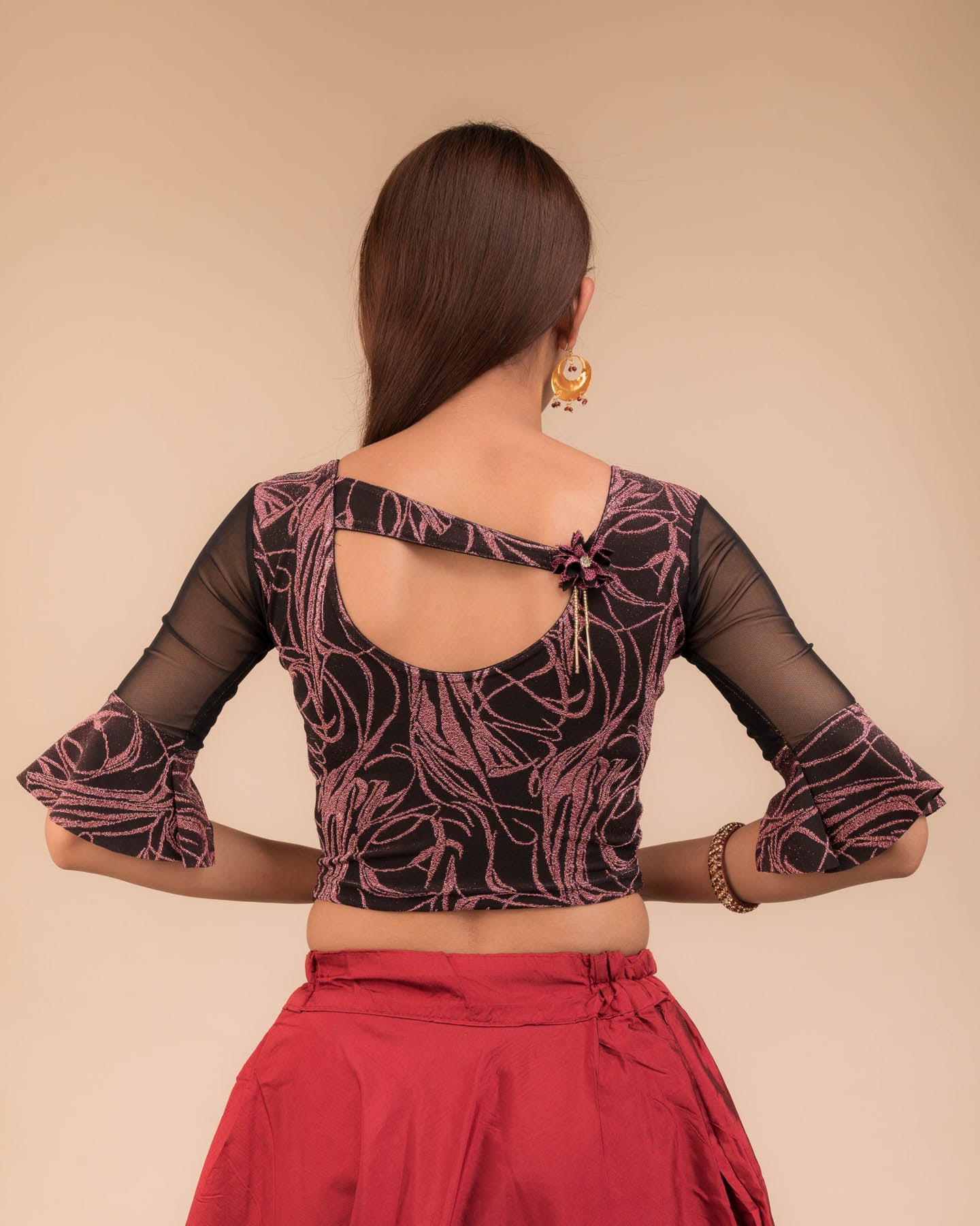 Rear view showcasing the appliqué detailing and back fit.