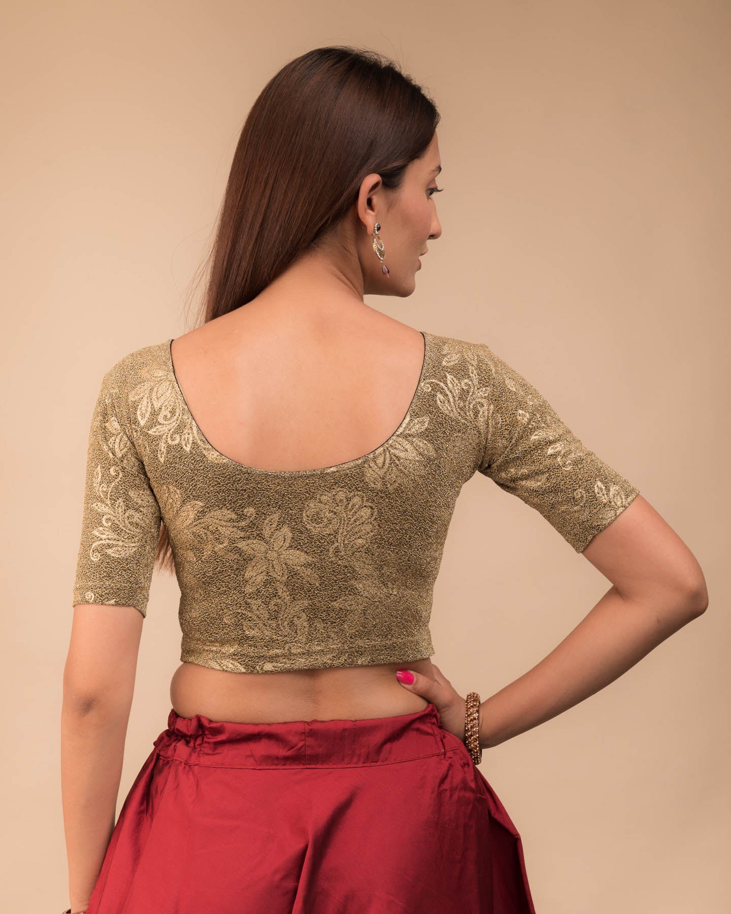 Rear view showcasing the metallic embossed pattern on the fabric.