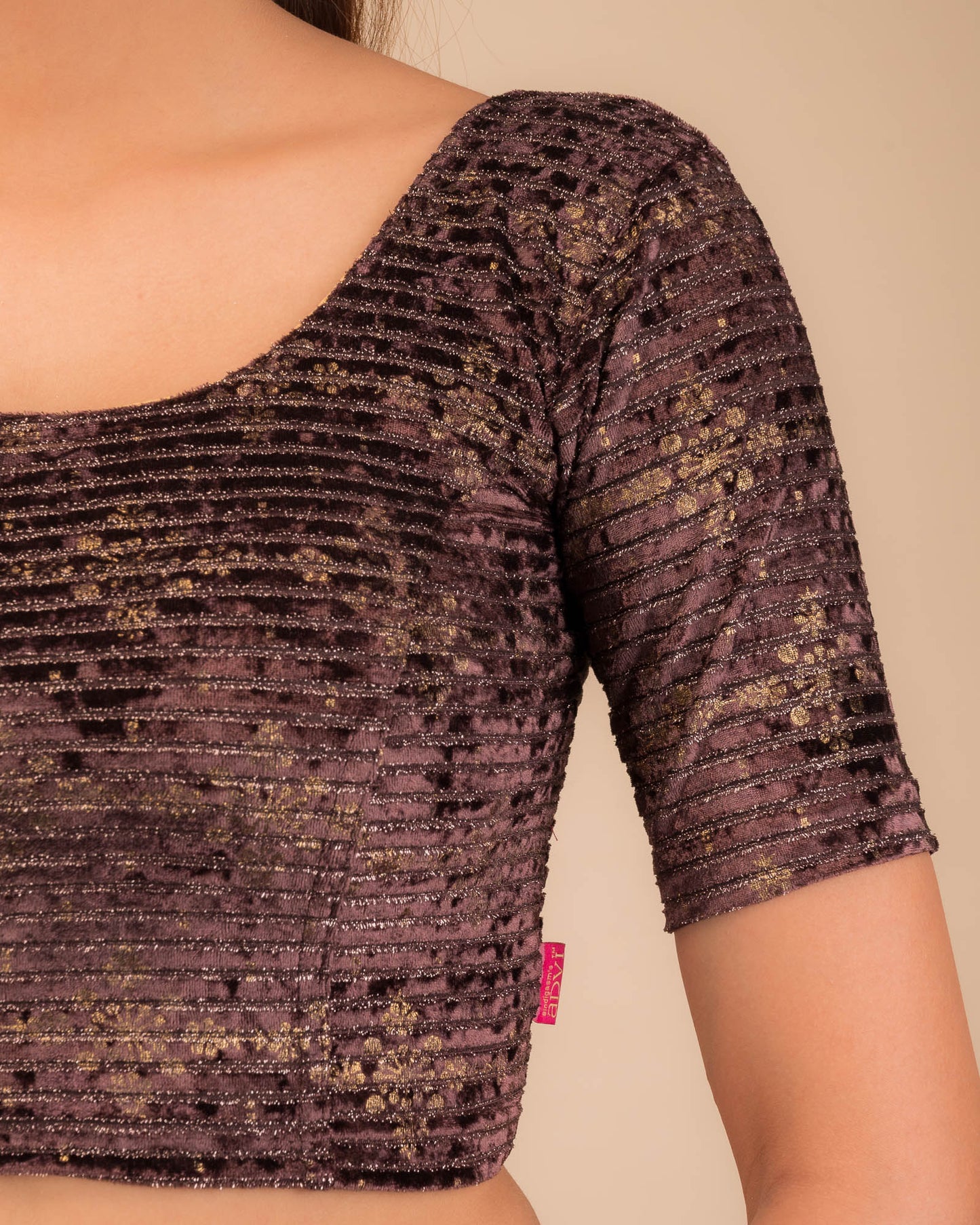 Close-up of velvet fabric with metallic foil embellishment.