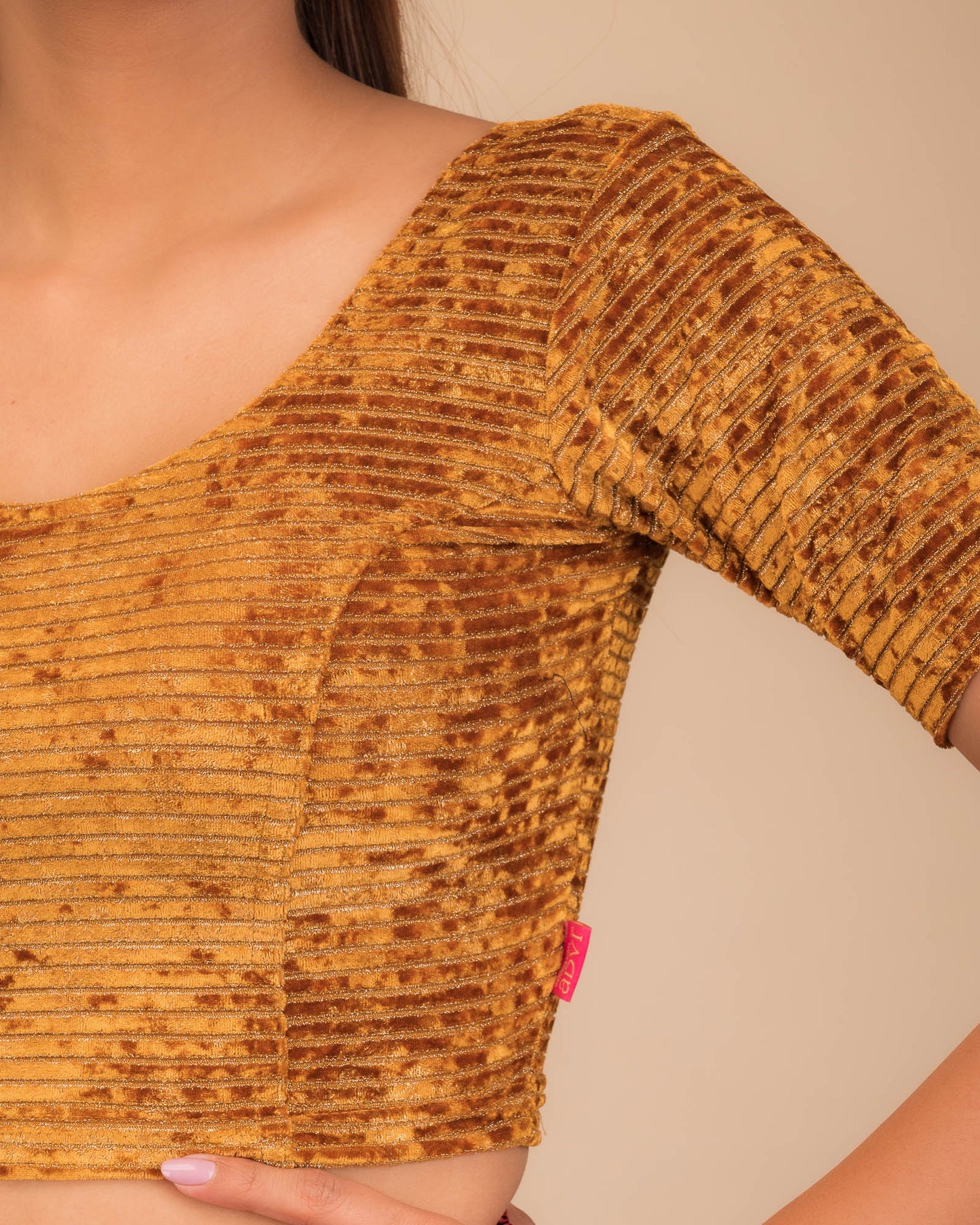 Close-up of velvet fabric with metallic foil embellishment.