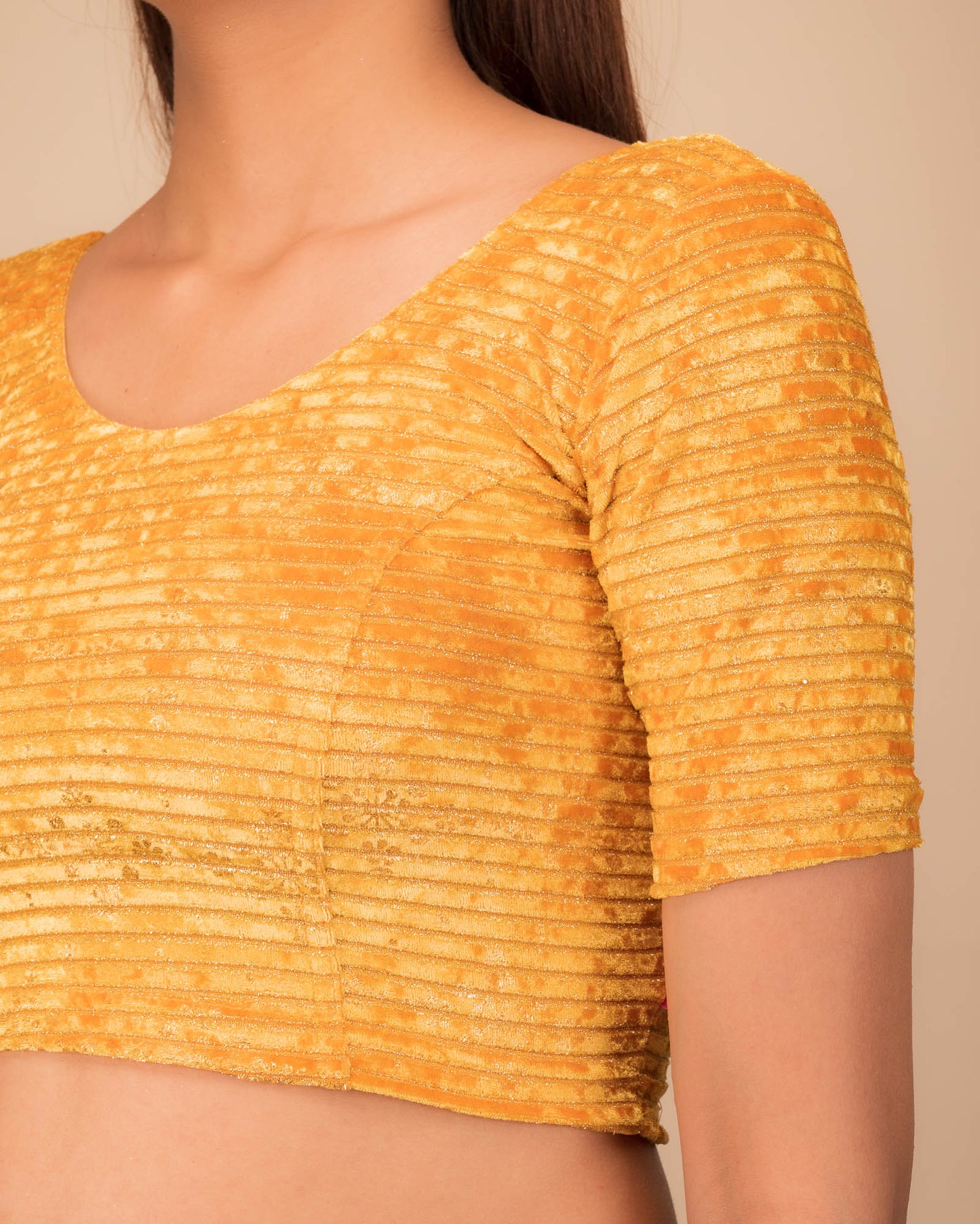 Close-up of velvet fabric with metallic foil embellishment.