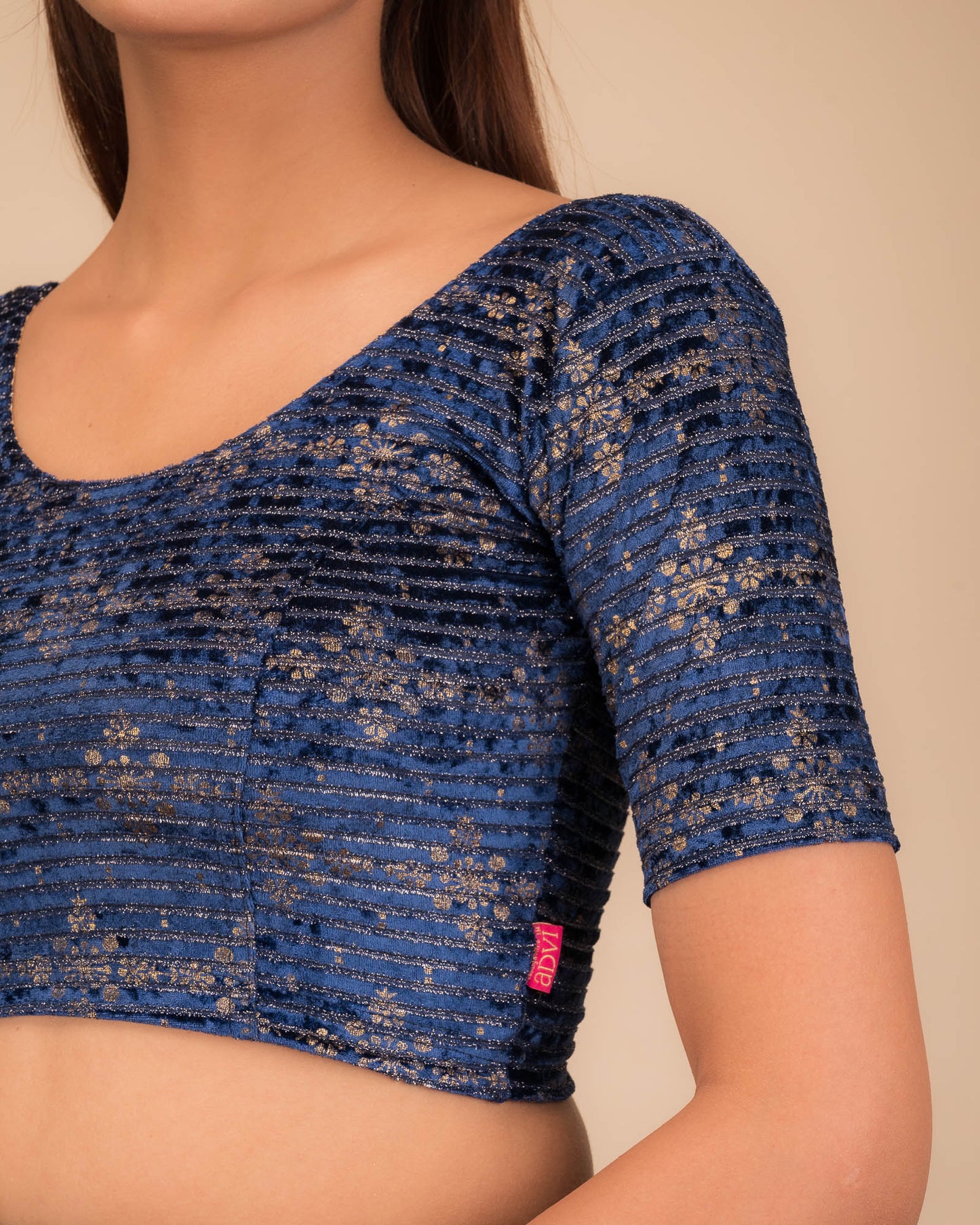Close-up of velvet fabric with metallic foil embellishment.
