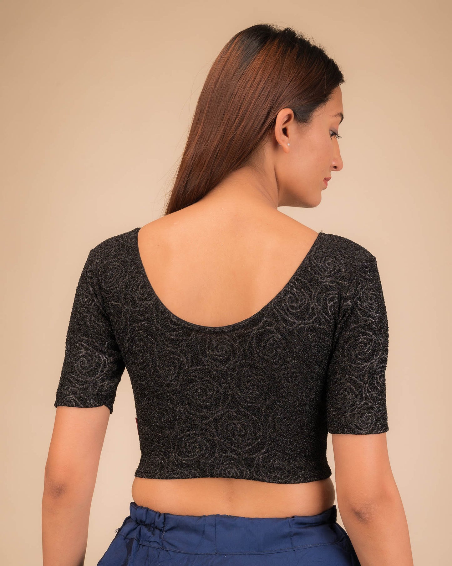 Rear view of the stretchable blouse showcasing the back design.