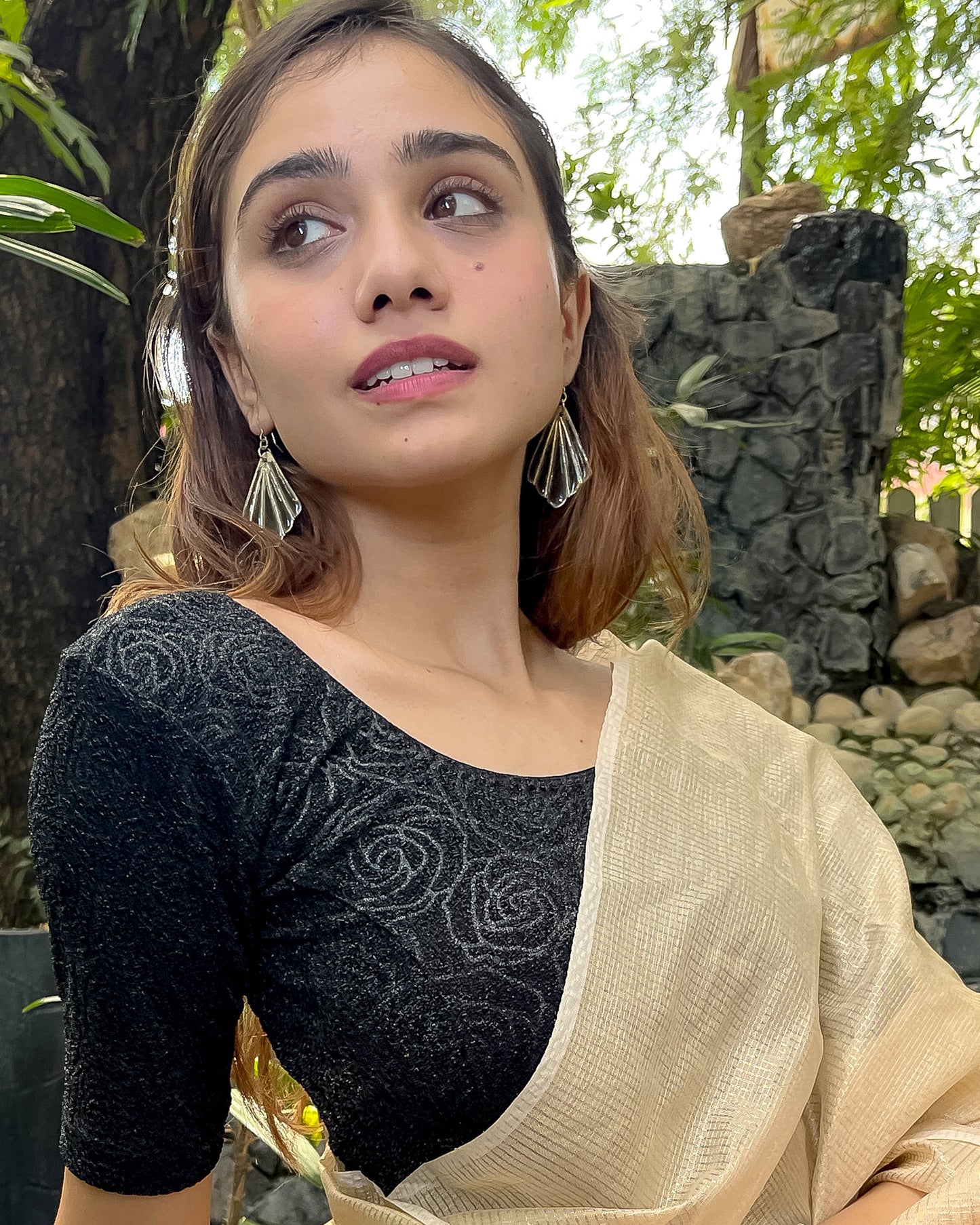 Model pairing the blouse with a saree for a festive ensemble.