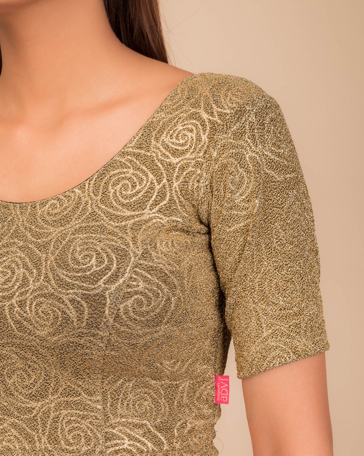 Close-up of the lurex knit fabric with embossed texture.