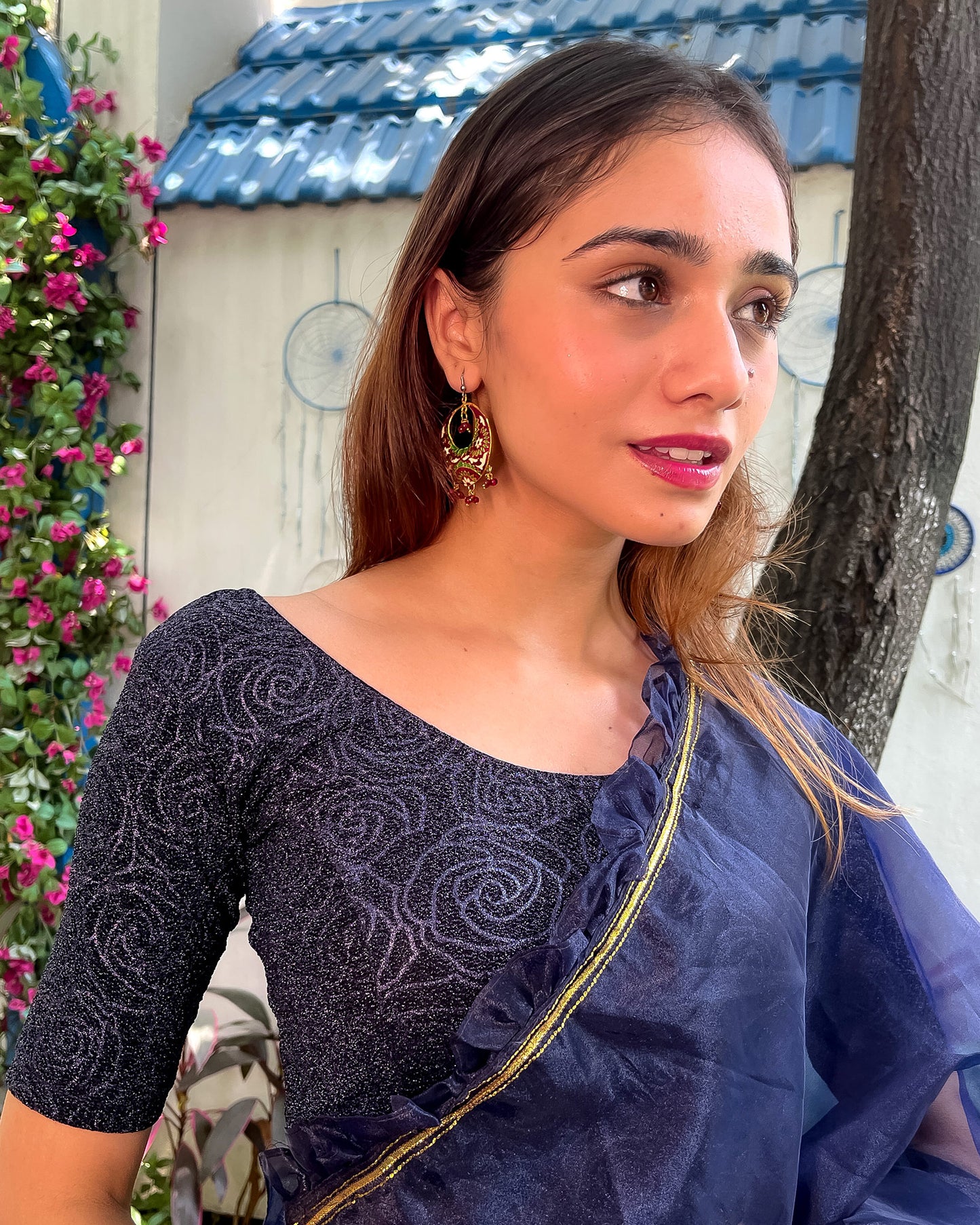 Model pairing the blouse with a saree for a festive ensemble.
