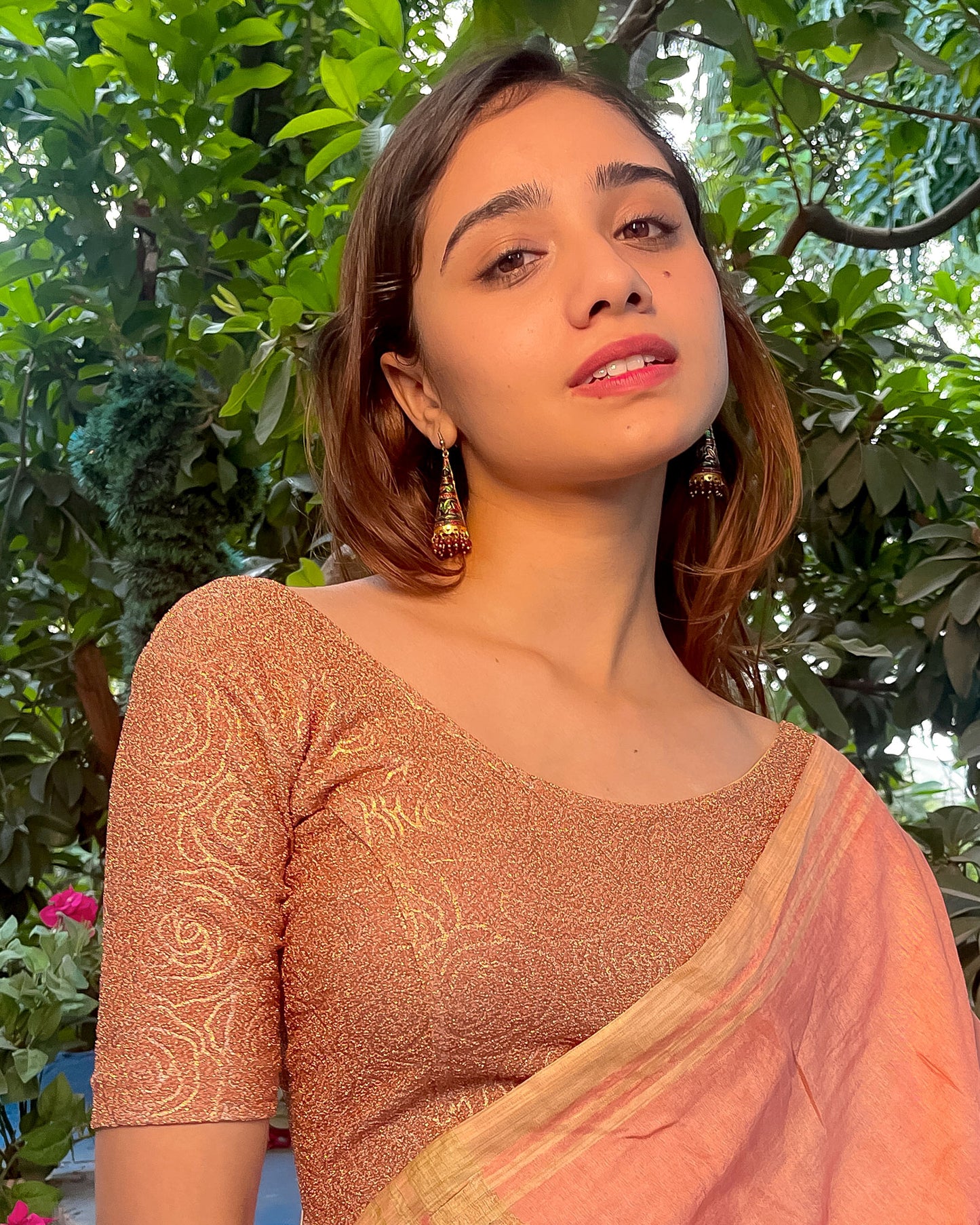 Model pairing the blouse with a saree for a festive ensemble.