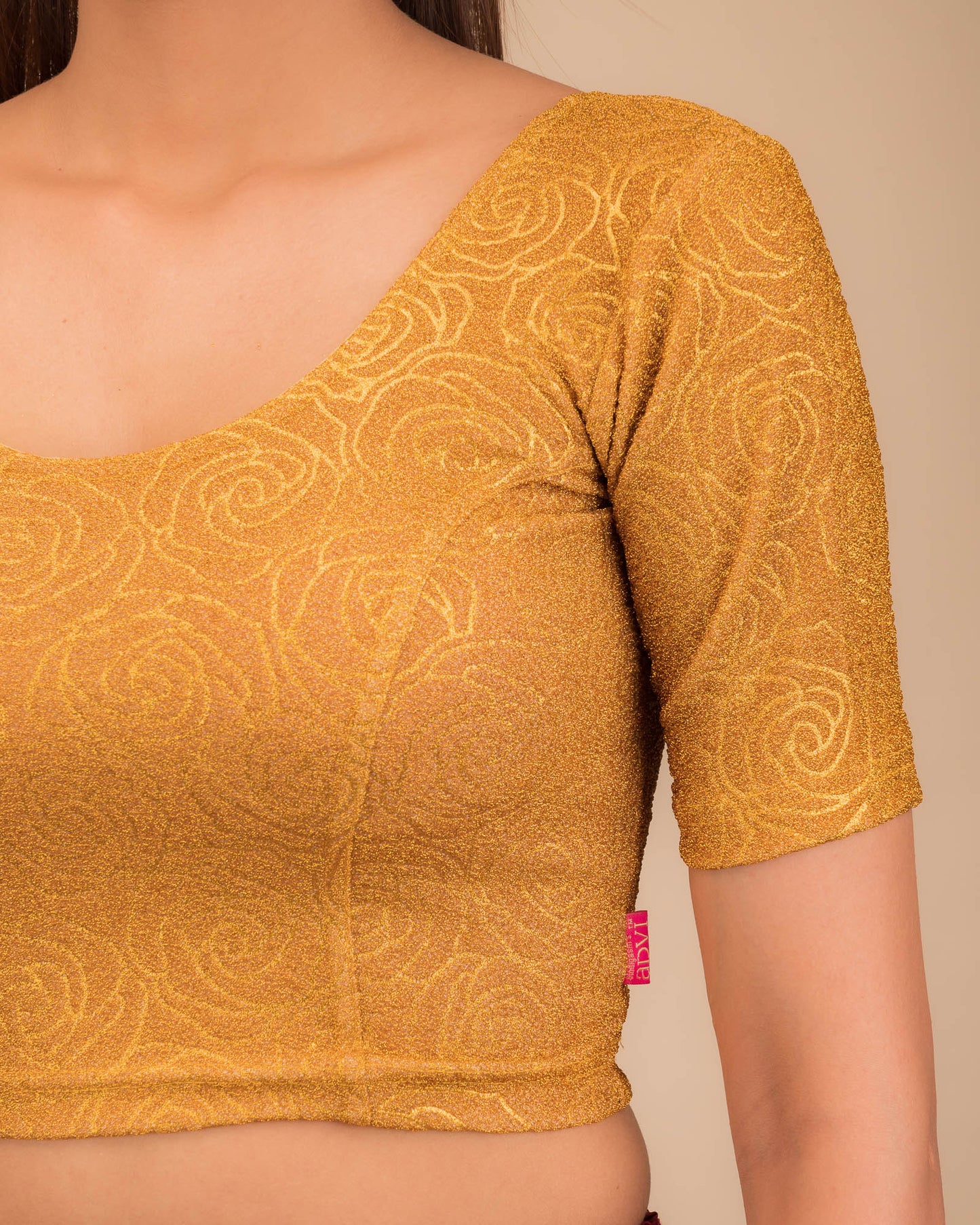 Model pairing the blouse with a saree for a festive ensemble.