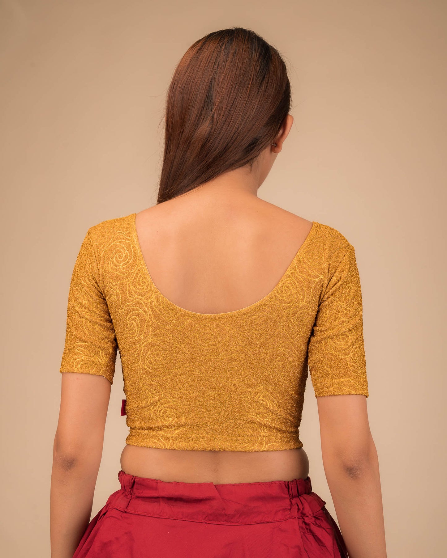 Rear view of the stretchable blouse showcasing the back design.
