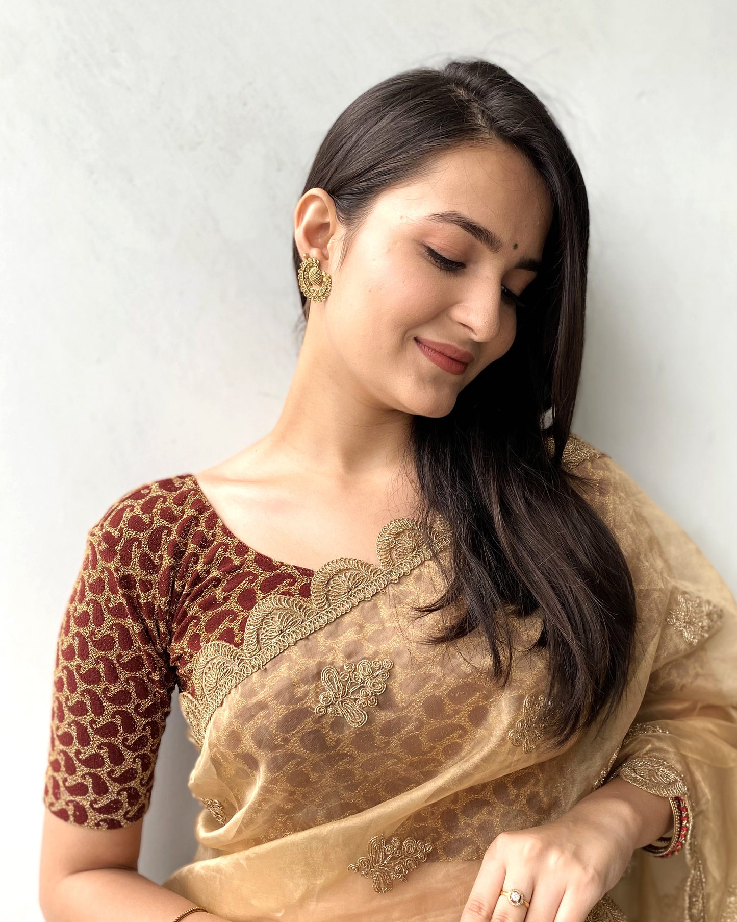 Model pairing the blouse with a saree for a festive look.