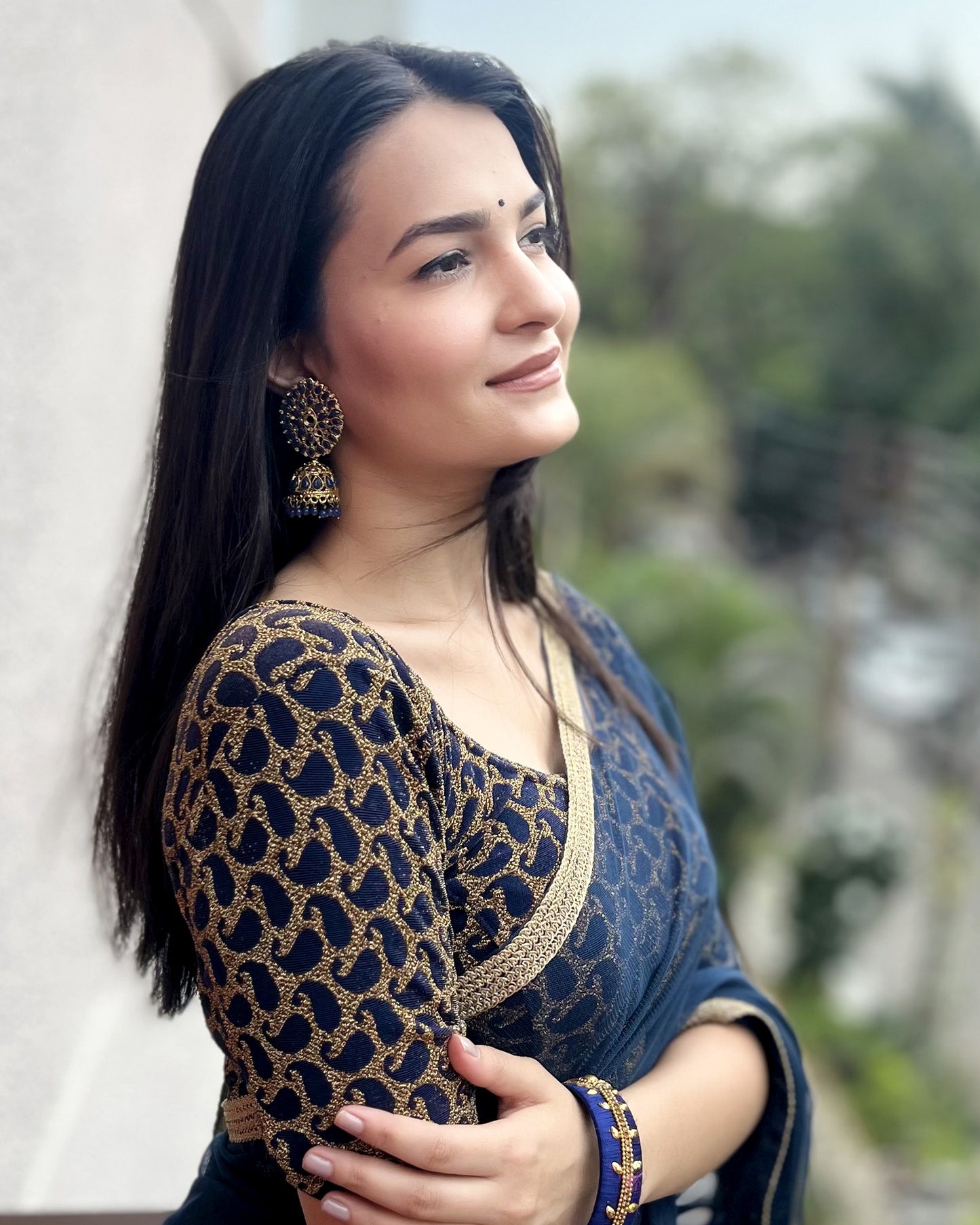 Model pairing the blouse with a saree for a festive look.