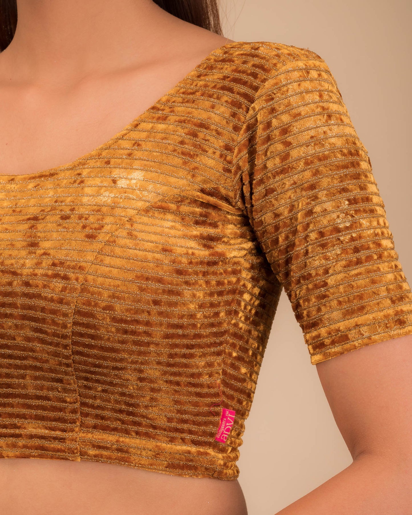 Close-up of the velvet fabric with metallic foil accents.