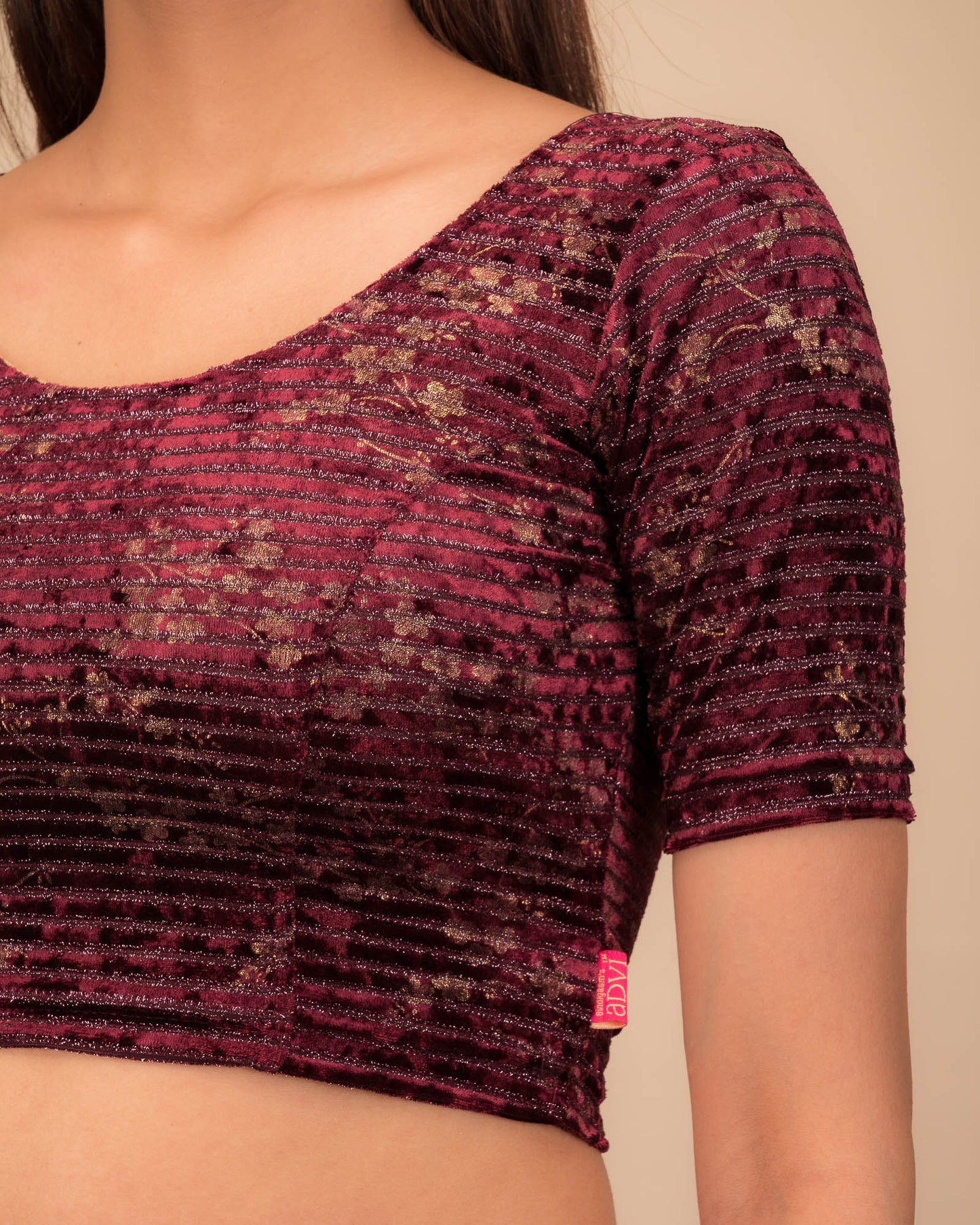 Close-up of the velvet fabric with metallic foil accents.