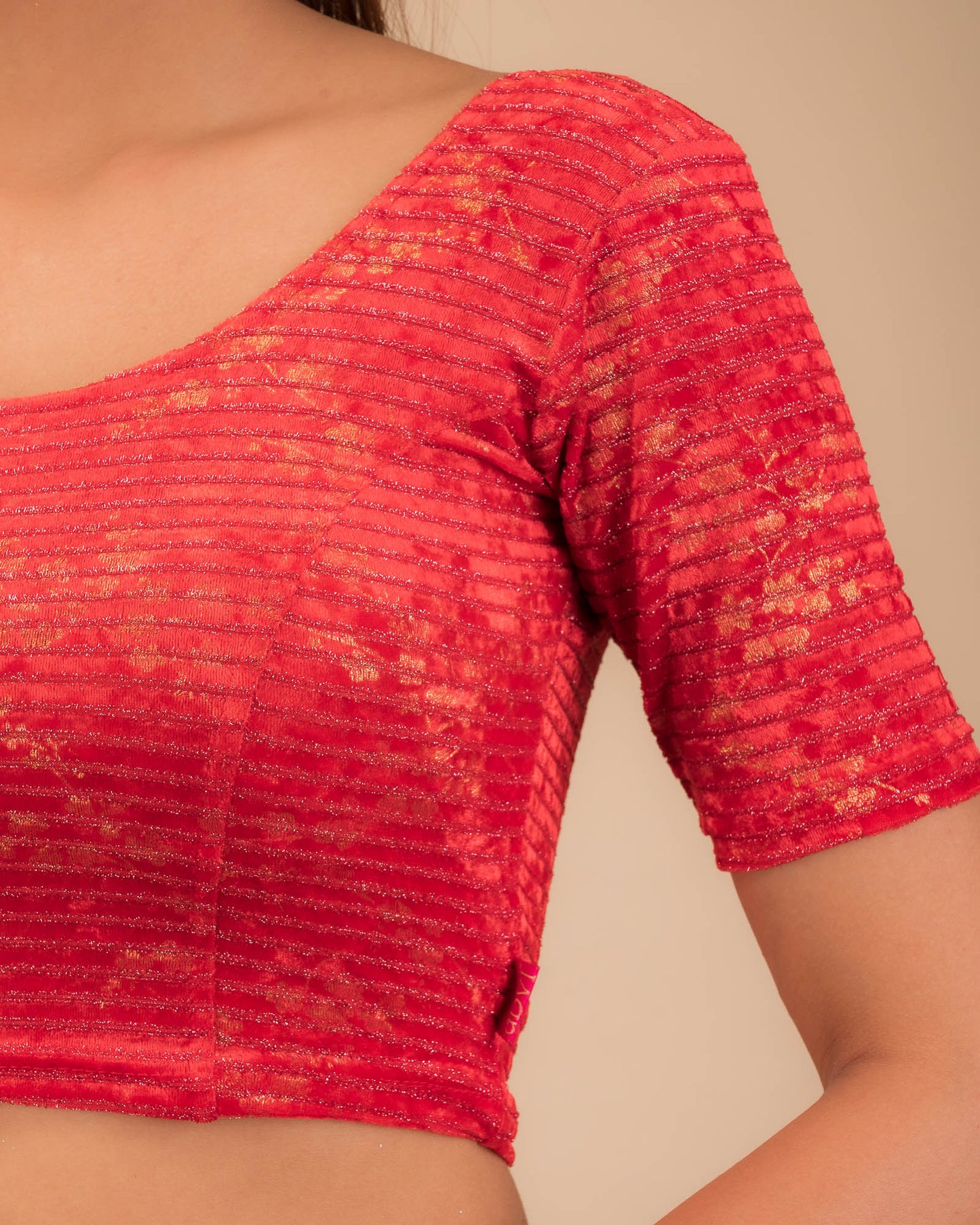 Close-up of the velvet fabric with metallic foil accents.