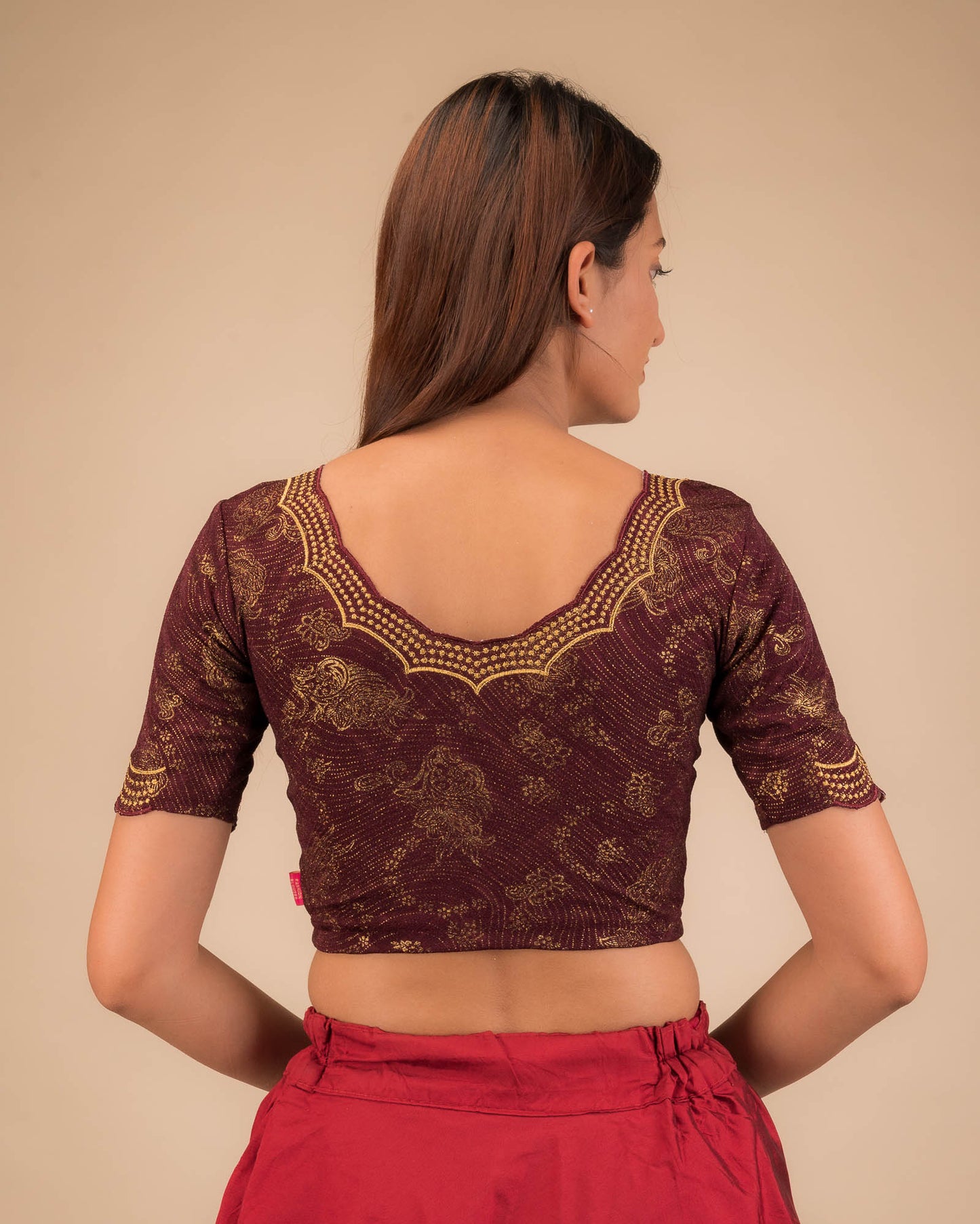 Rear view showcasing the blouse’s back design.