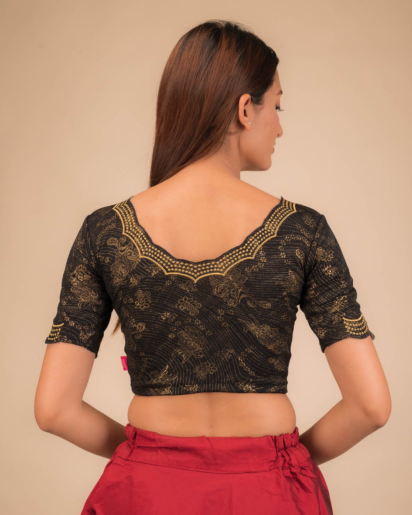 Rear view showcasing the blouse’s back design.