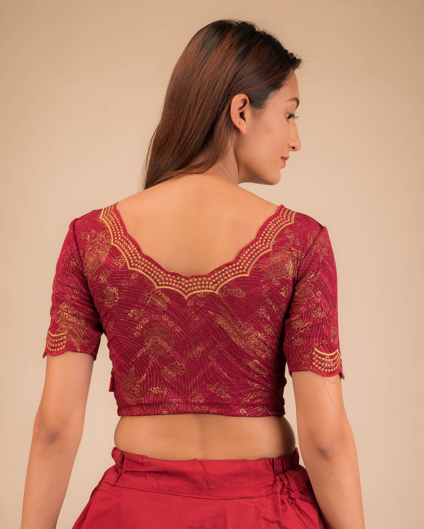 Rear view showcasing the blouse’s back design.