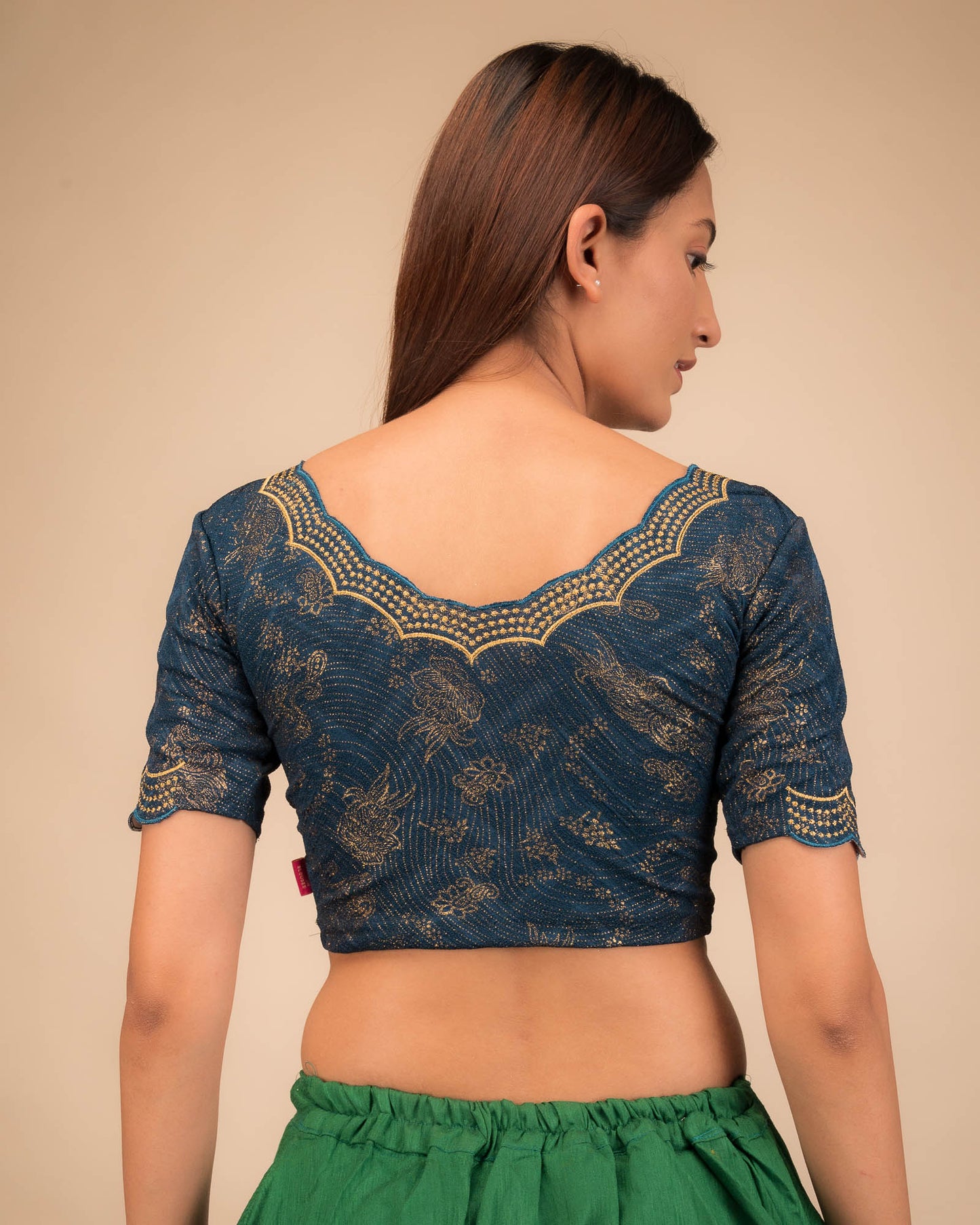 Rear view showcasing the blouse’s back design.